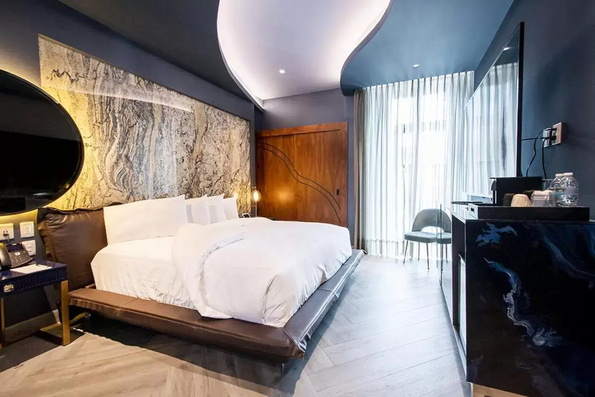 Bed in L Hotel Perla Boutique