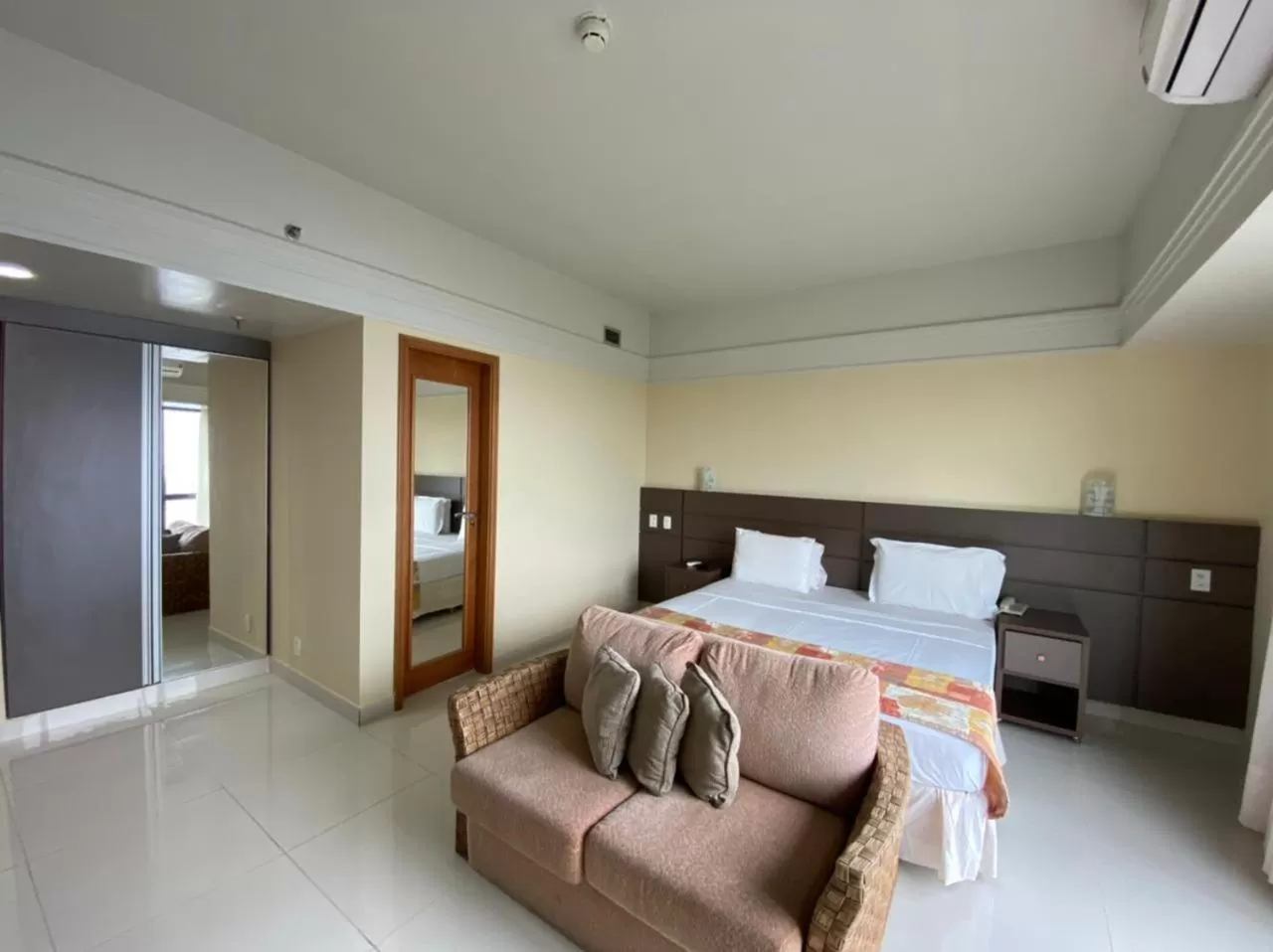 Bed in Tropical Executive Hotel