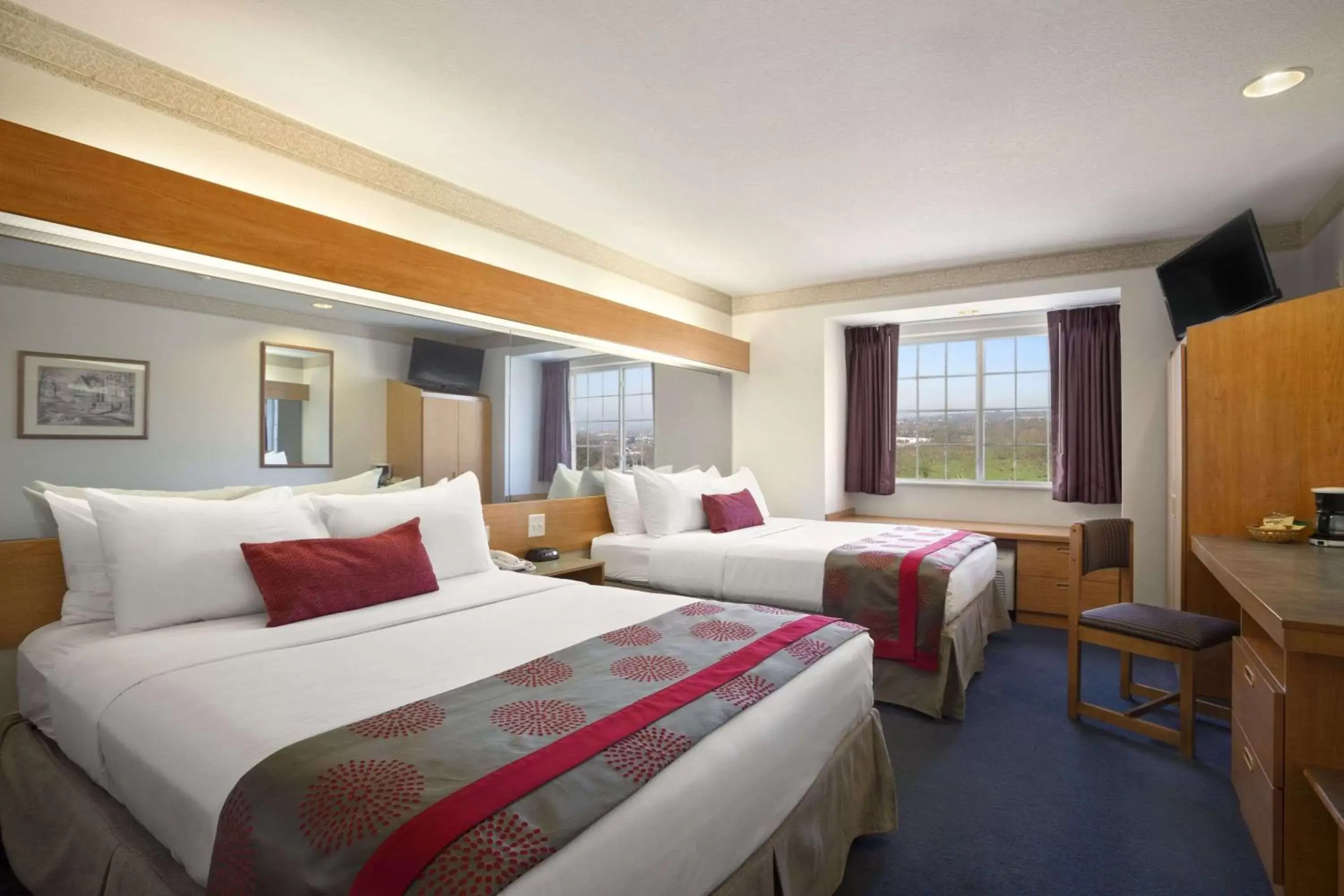 Photo of the whole room, Bed in Ramada Limited and Suites Bloomington