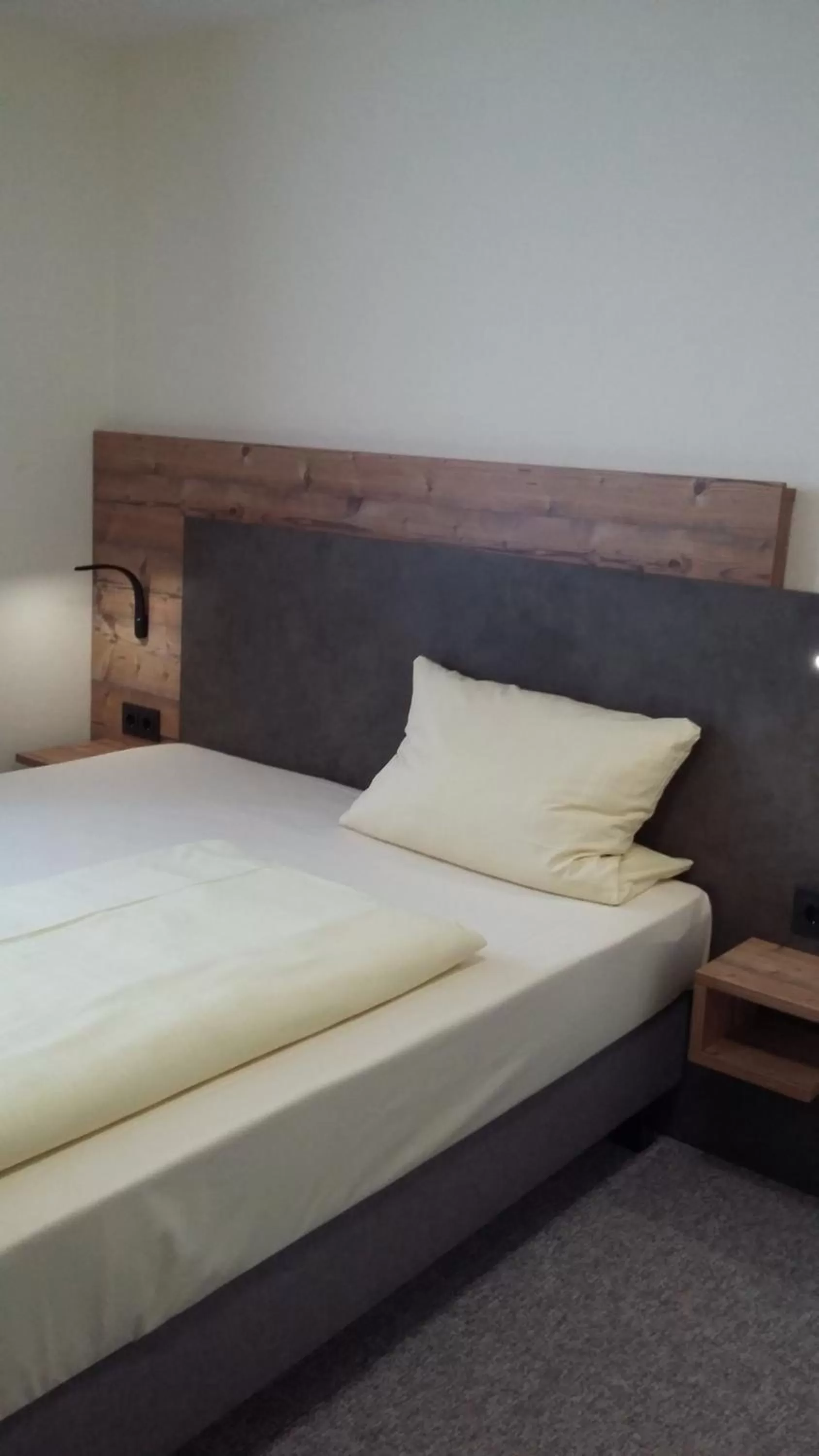 Bed in Hotel Angerer