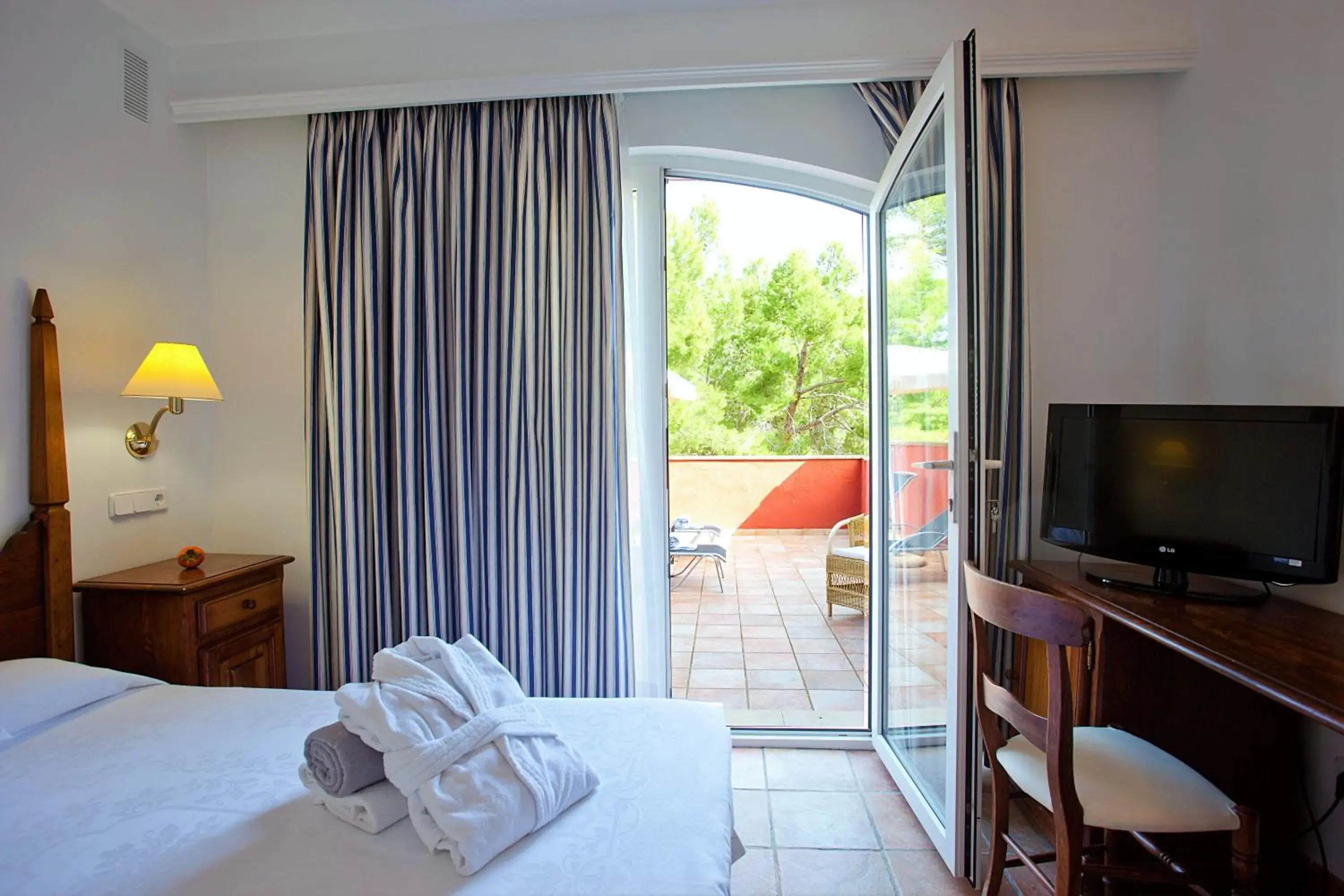 Photo of the whole room, Bed in Hotel Cala Sant Vicenc - Adults Only