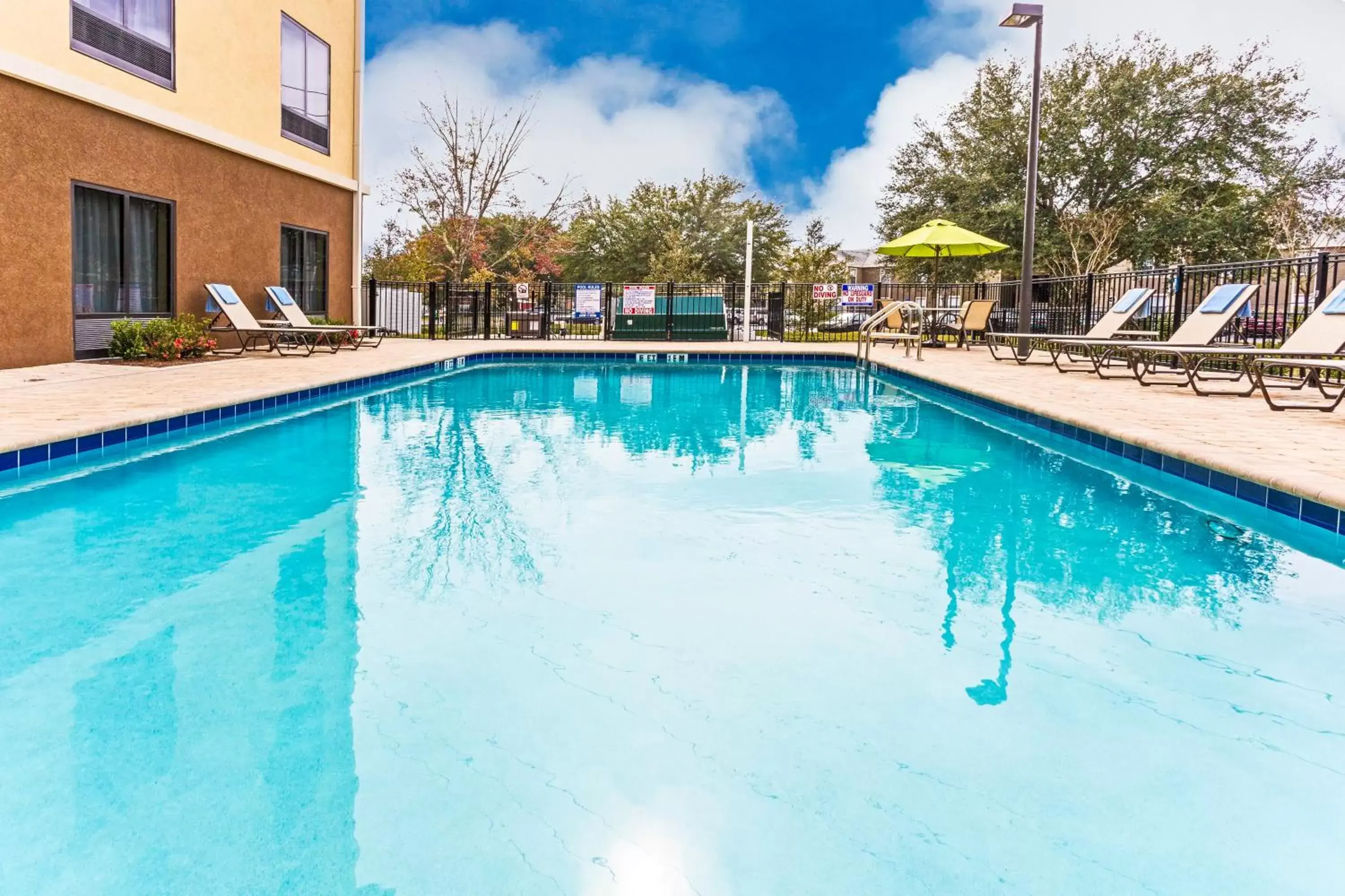Swimming Pool in Holiday Inn Express Hotel & Suites Orlando East-UCF Area, an IHG Hotel