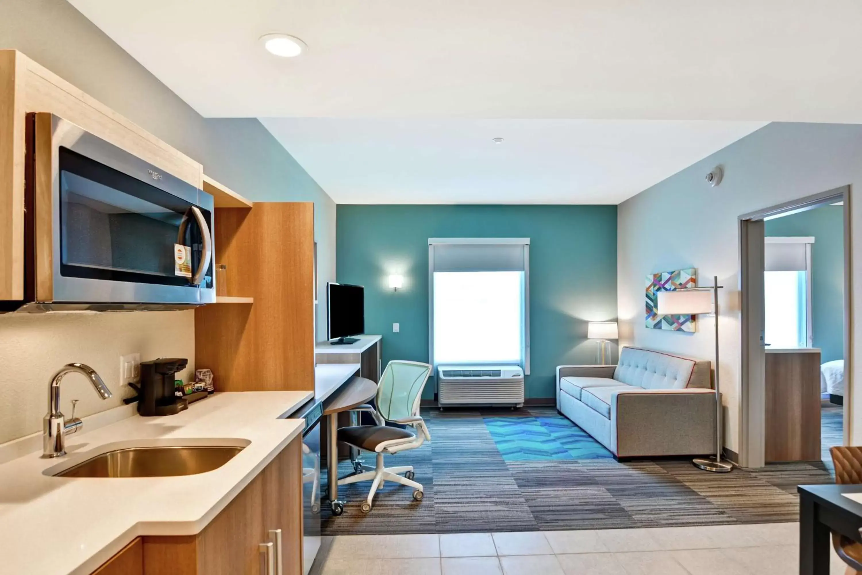 Bedroom, Kitchen/Kitchenette in Home2 Suites By Hilton Daytona Beach Speedway