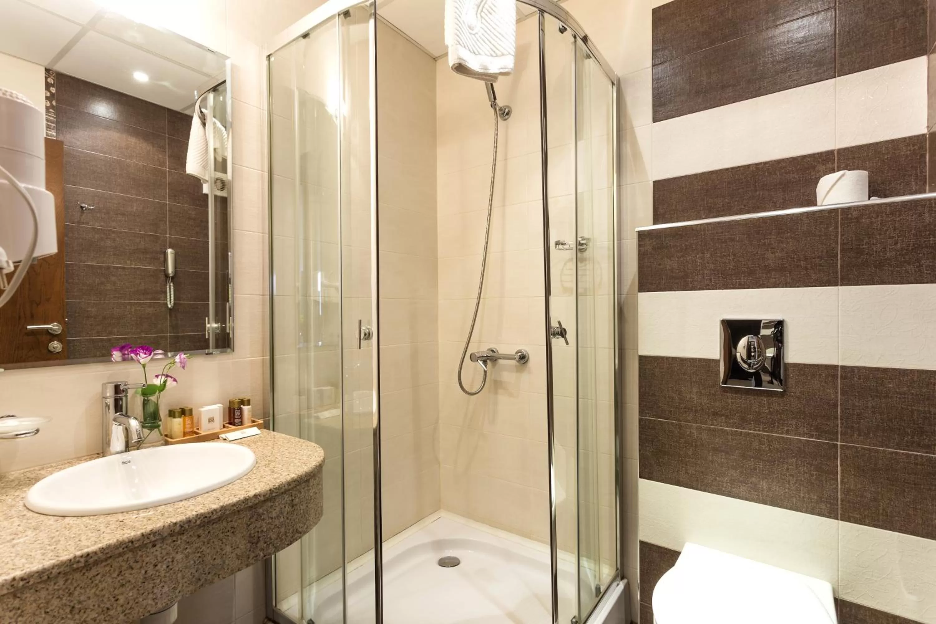 Shower in City Avenue Hotel by HMG-Free Parking-Free Wi-Fi