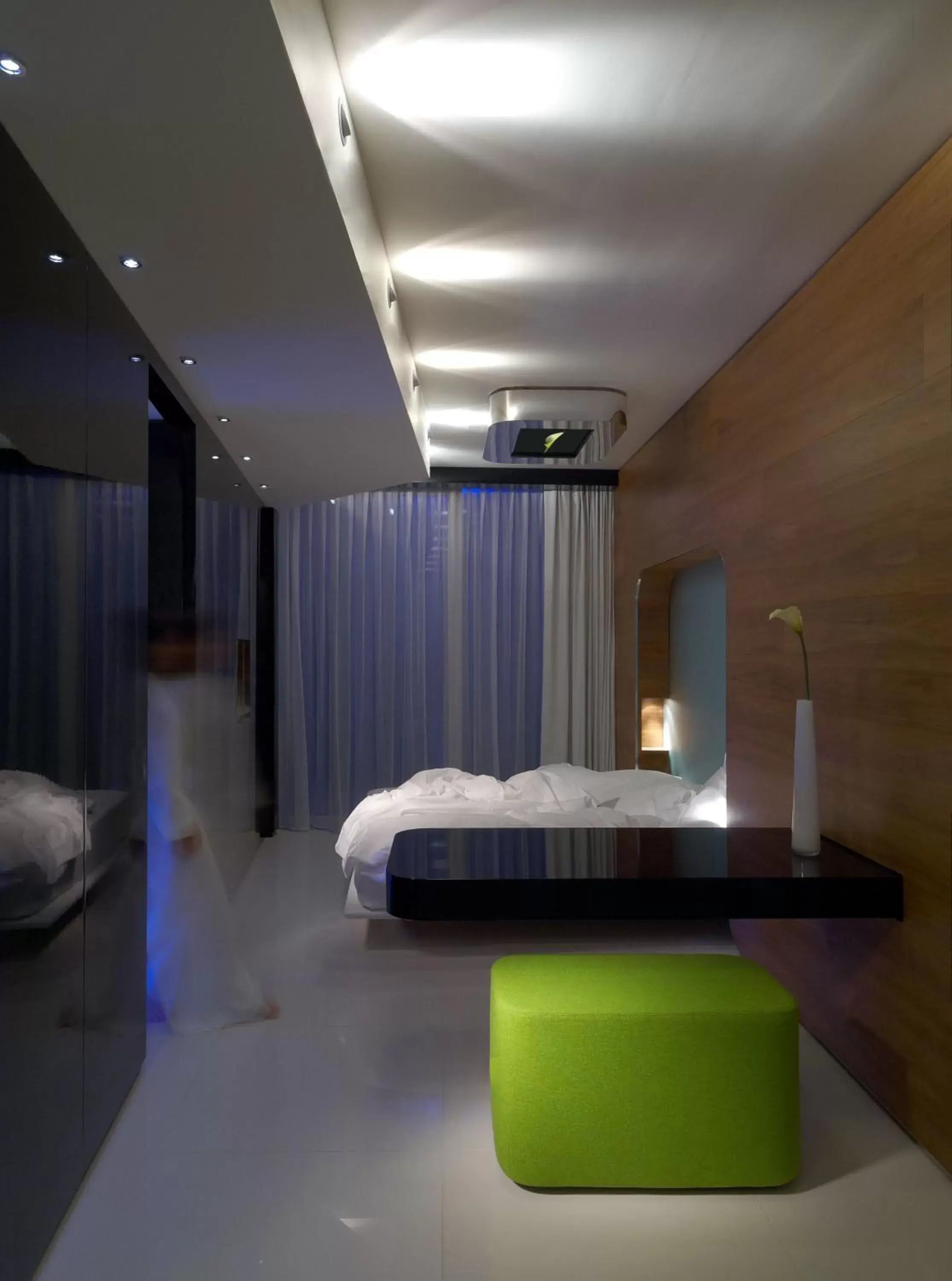 Bed in i-Suite Hotel