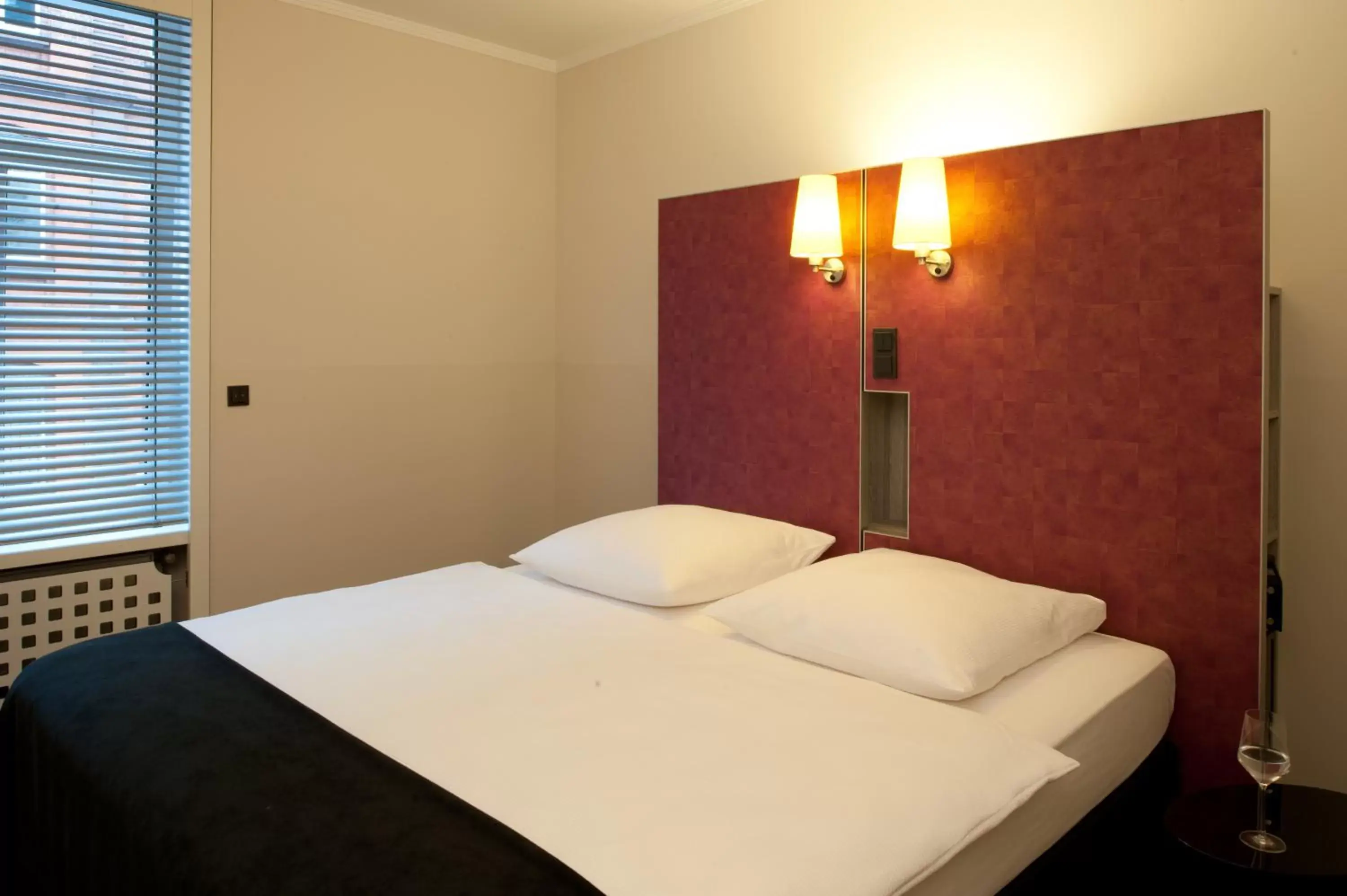 Bed in Hotel Topas Frankfurt City