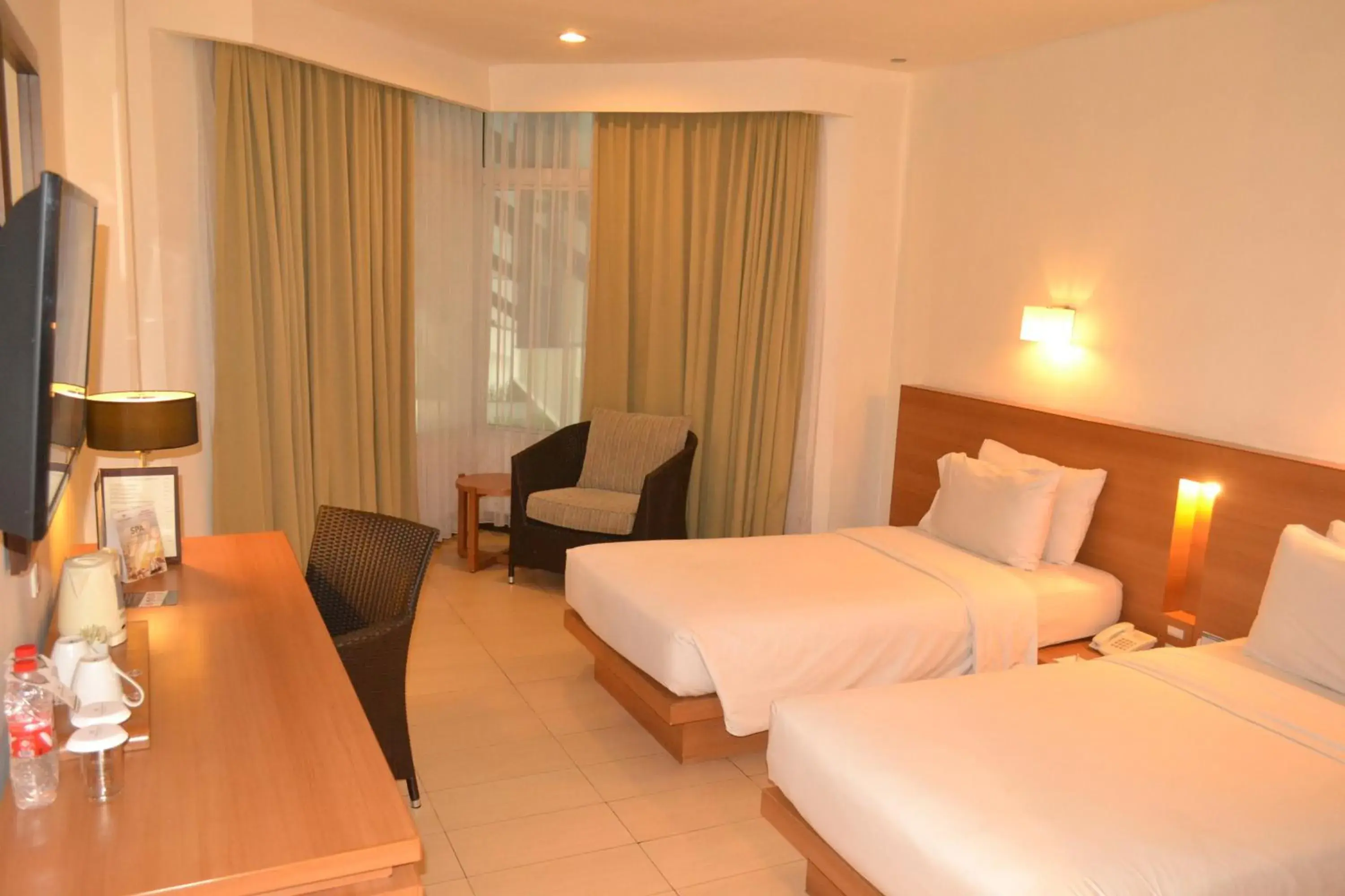 Photo of the whole room, Bed in Hotel Santika Bandung