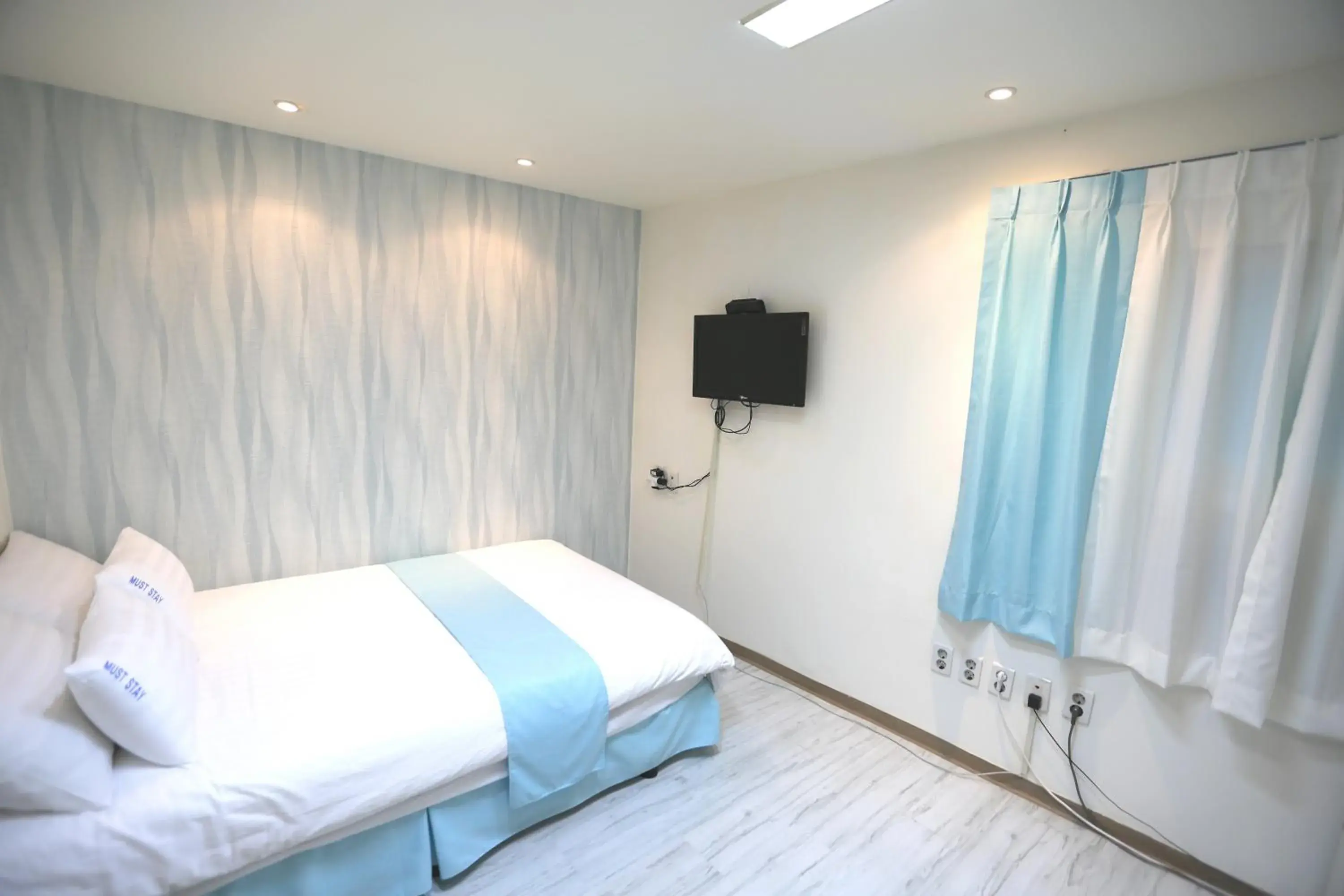 Bed in MUST STAY HOTEL Myeongdong