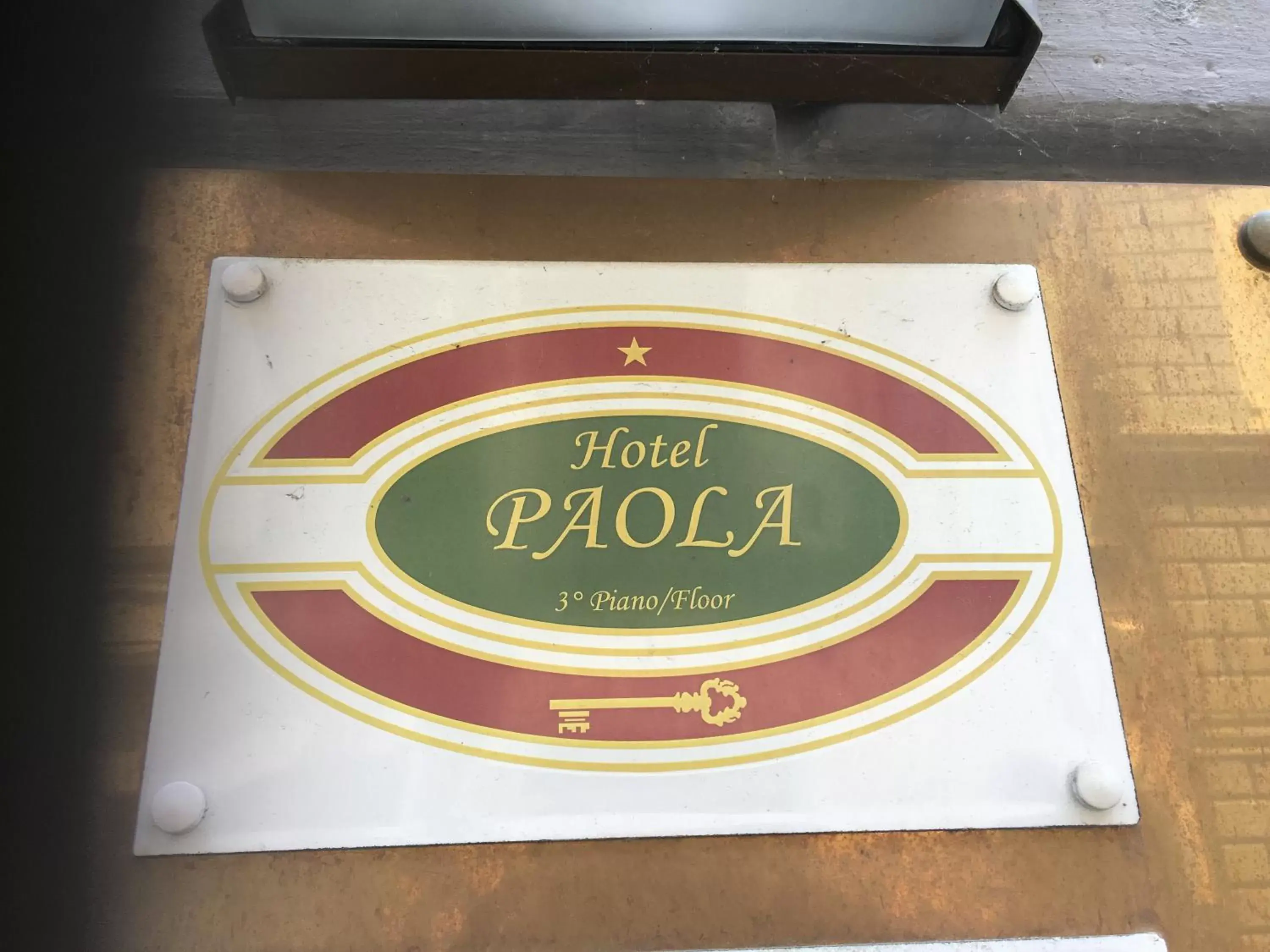 Property logo or sign in Hotel Paola
