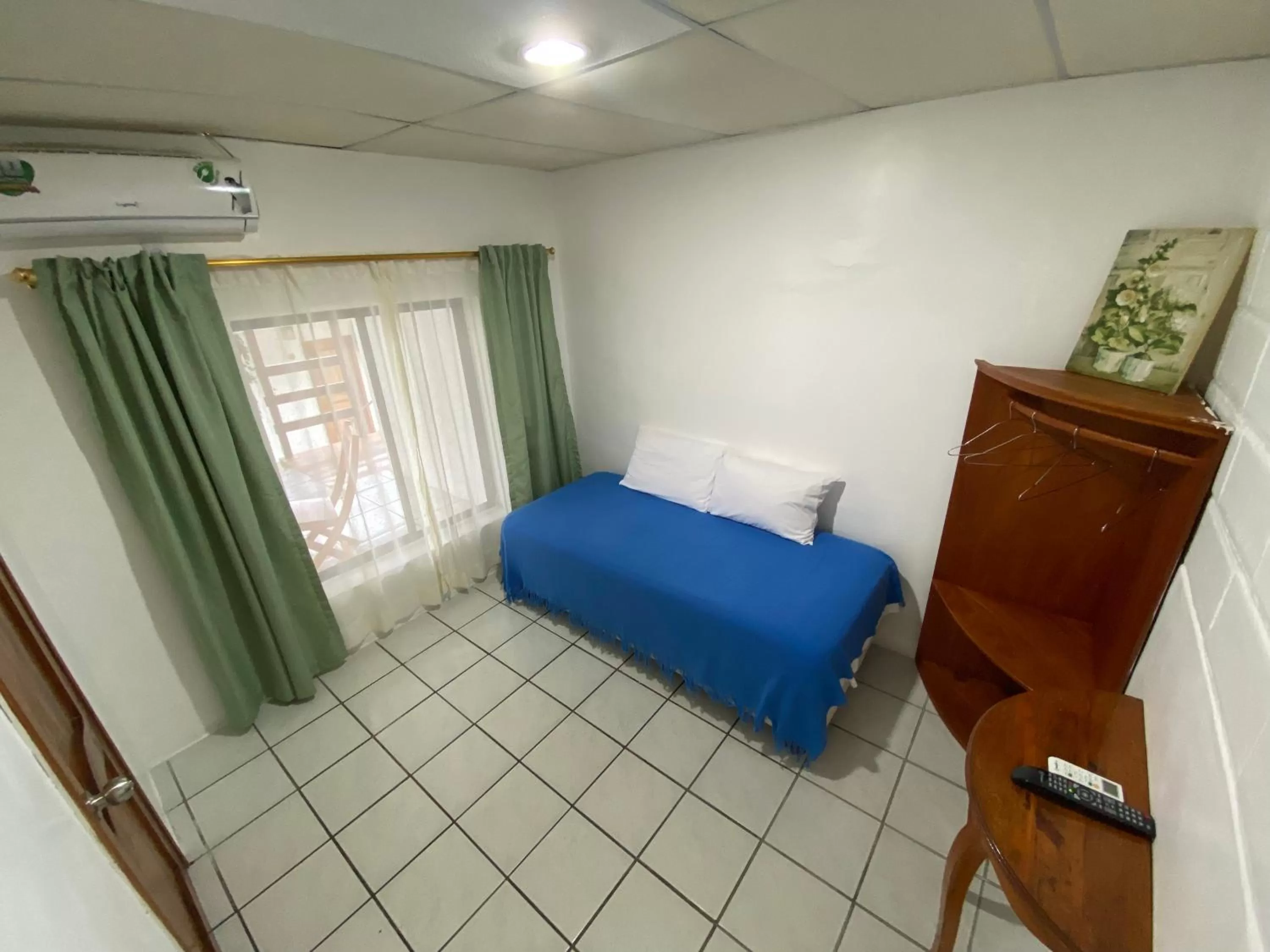 Bed in La Peregrina Galapagos B&B