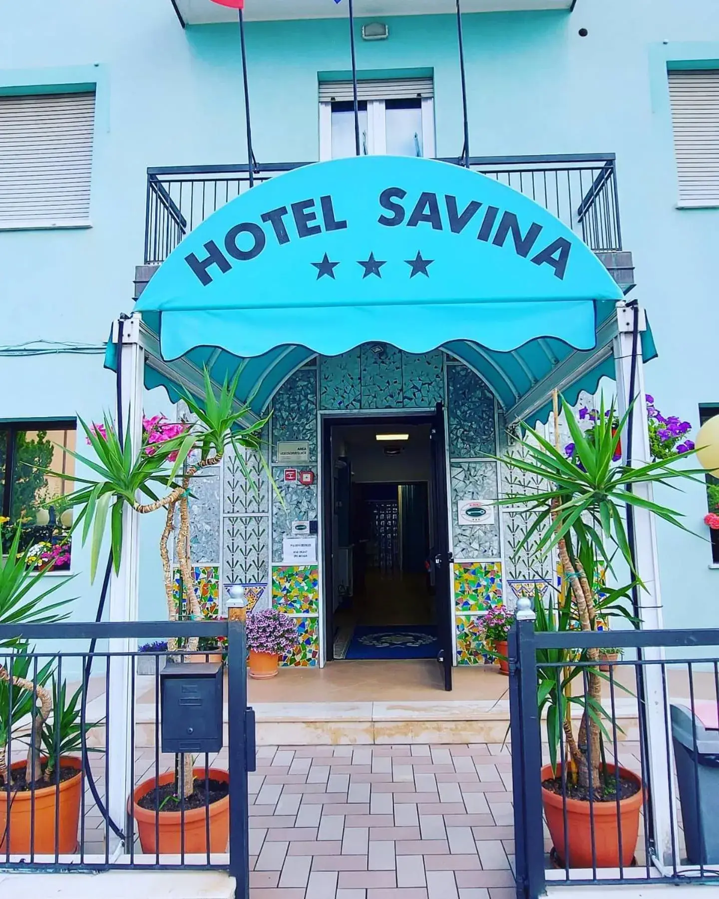 Property logo or sign in Hotel Savina
