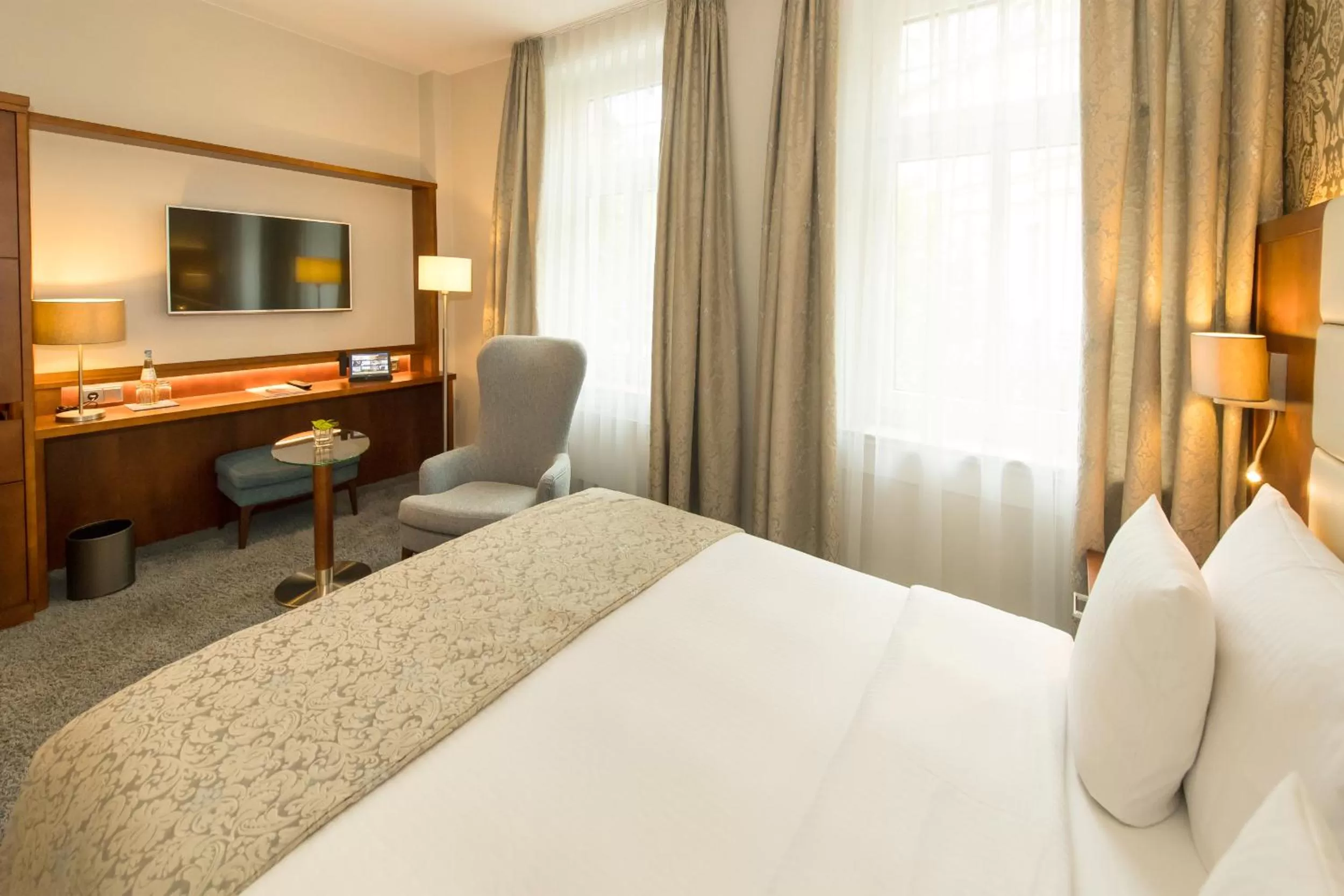 Photo of the whole room, Bed in Hotel Oranien Wiesbaden