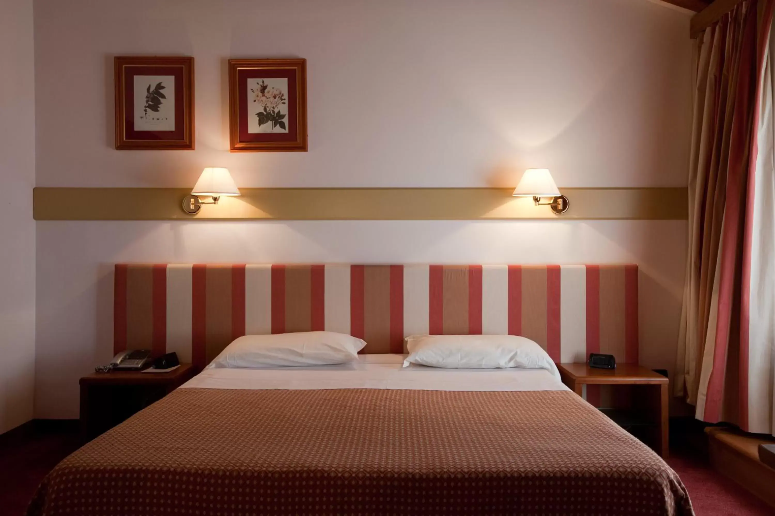 Bed in Eurohotel Palace Maniago