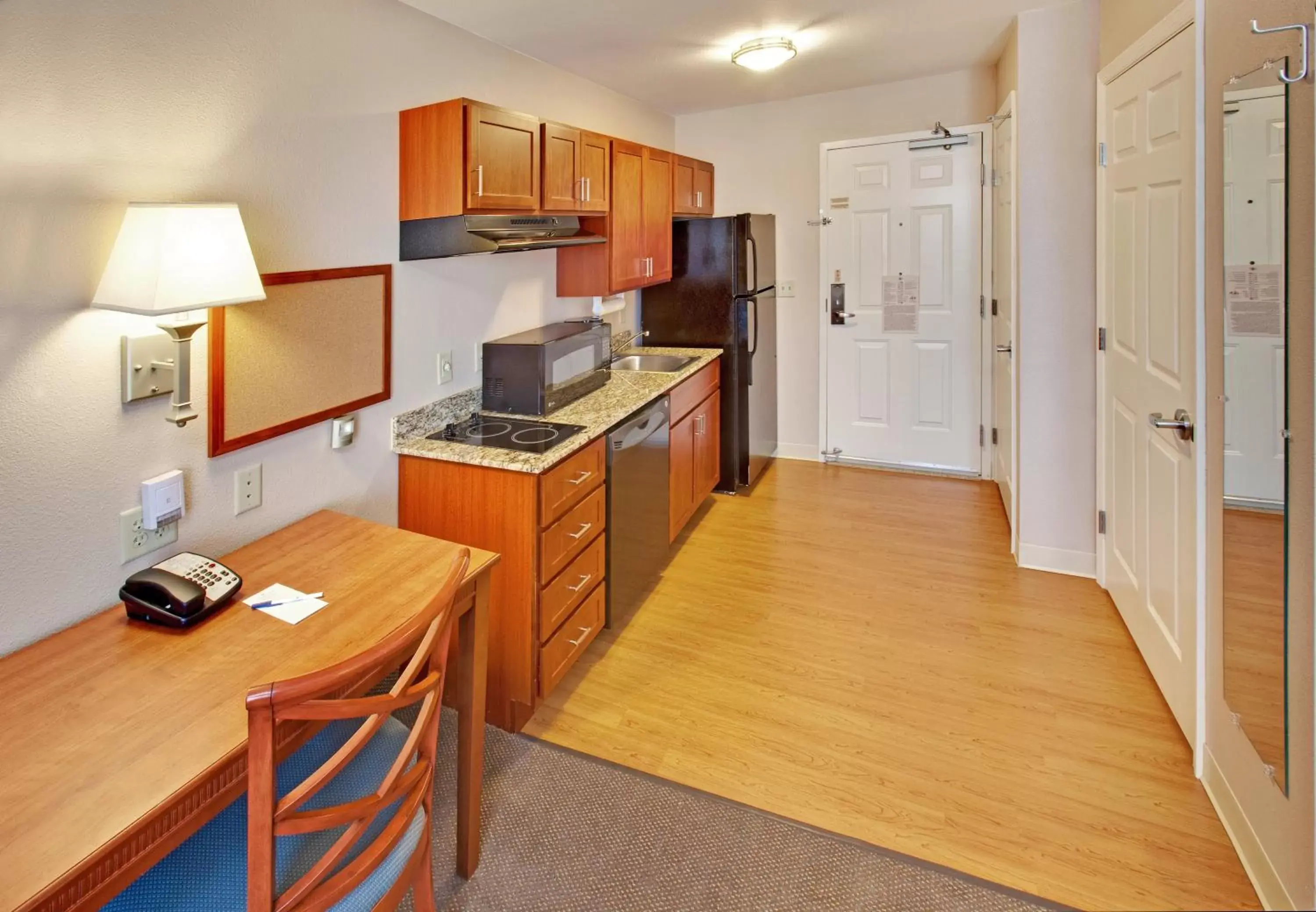 Photo of the whole room, Kitchen/Kitchenette in Candlewood Suites Williston, an IHG Hotel