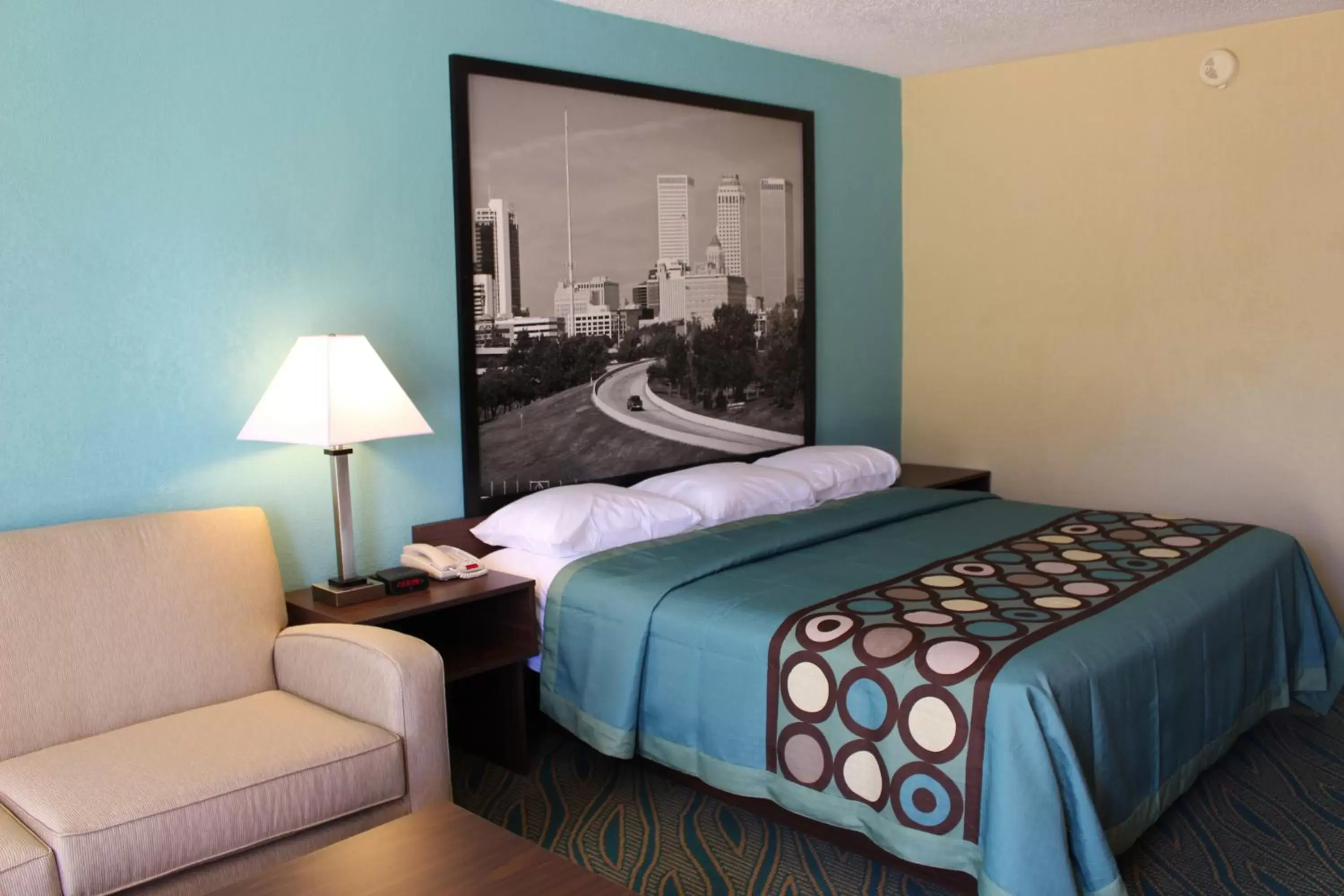 Seating area, Bed in Super 8 by Wyndham Duncan Seating area, Bed in Super 8 by Wyndham Duncan