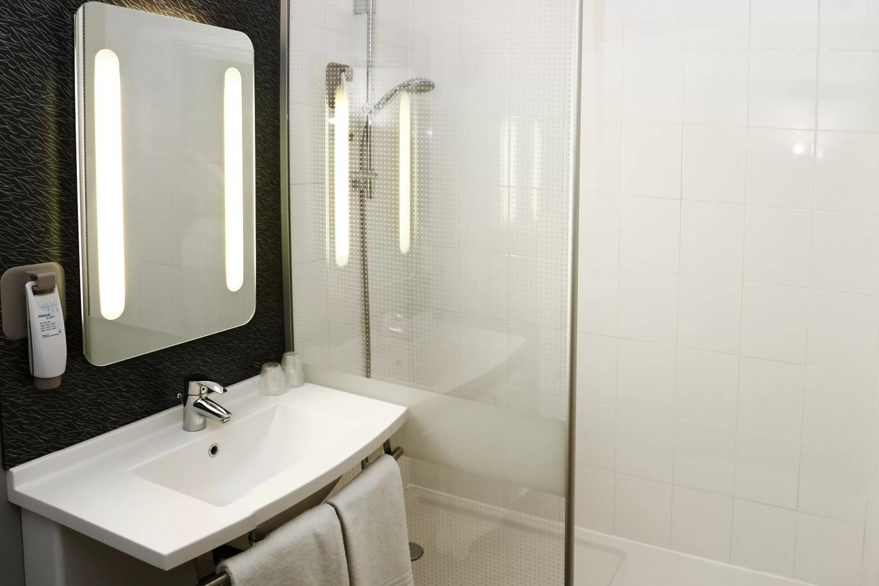 Bathroom in ibis Orange Centre