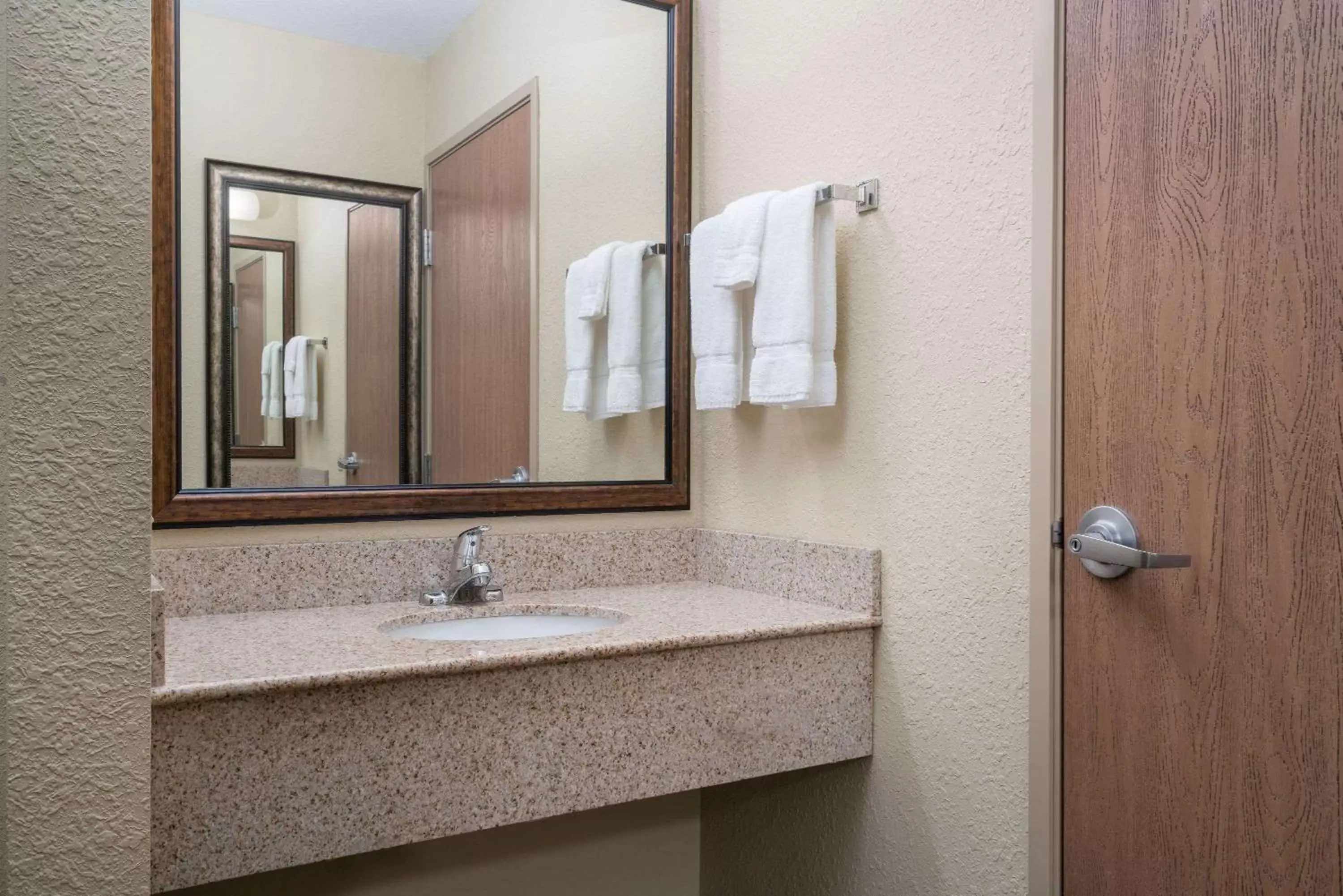 Bathroom in AmericInn by Wyndham Newton