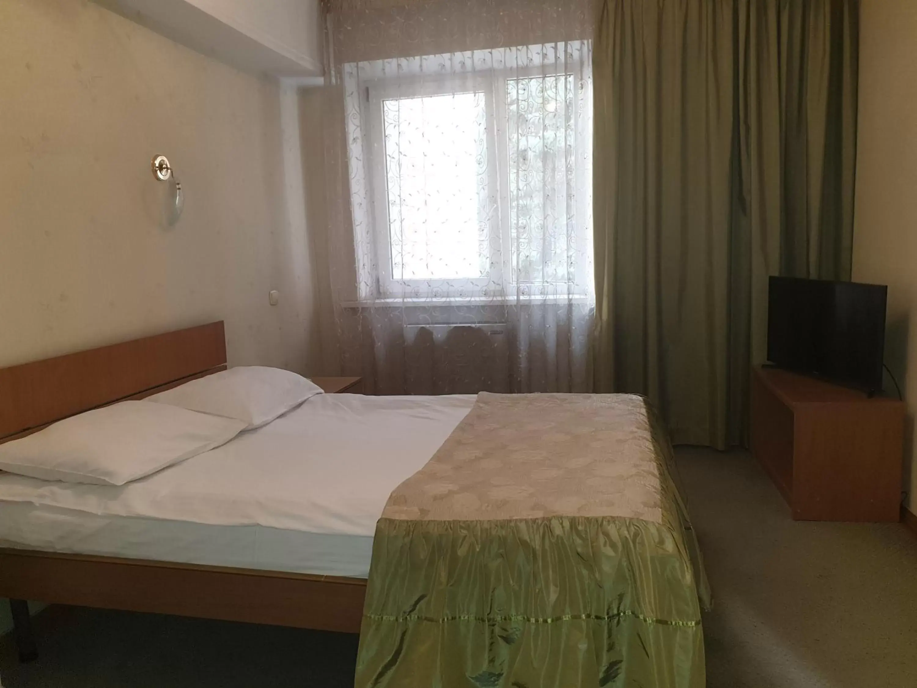 Bed in Dacia Hotel