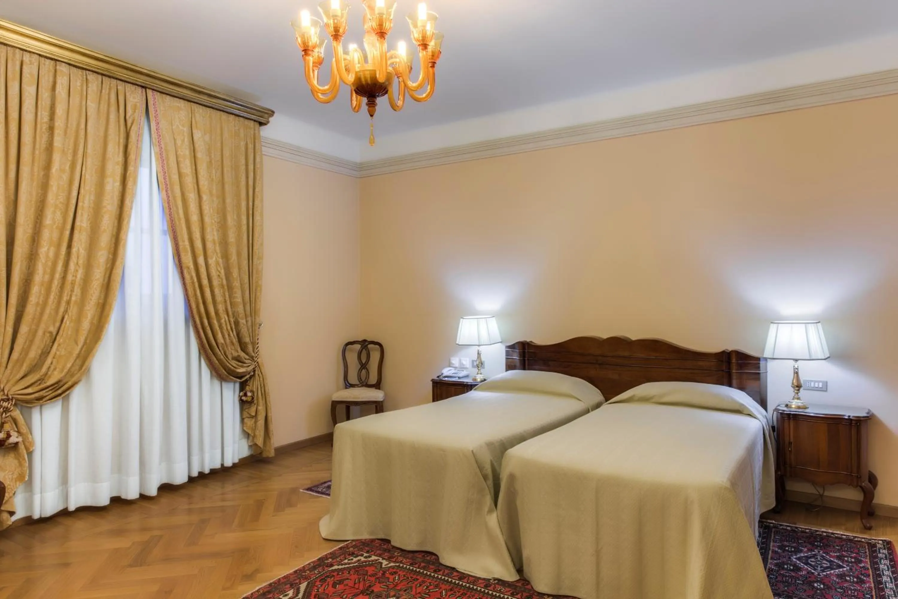 Bed in Villa Fenaroli Palace Hotel