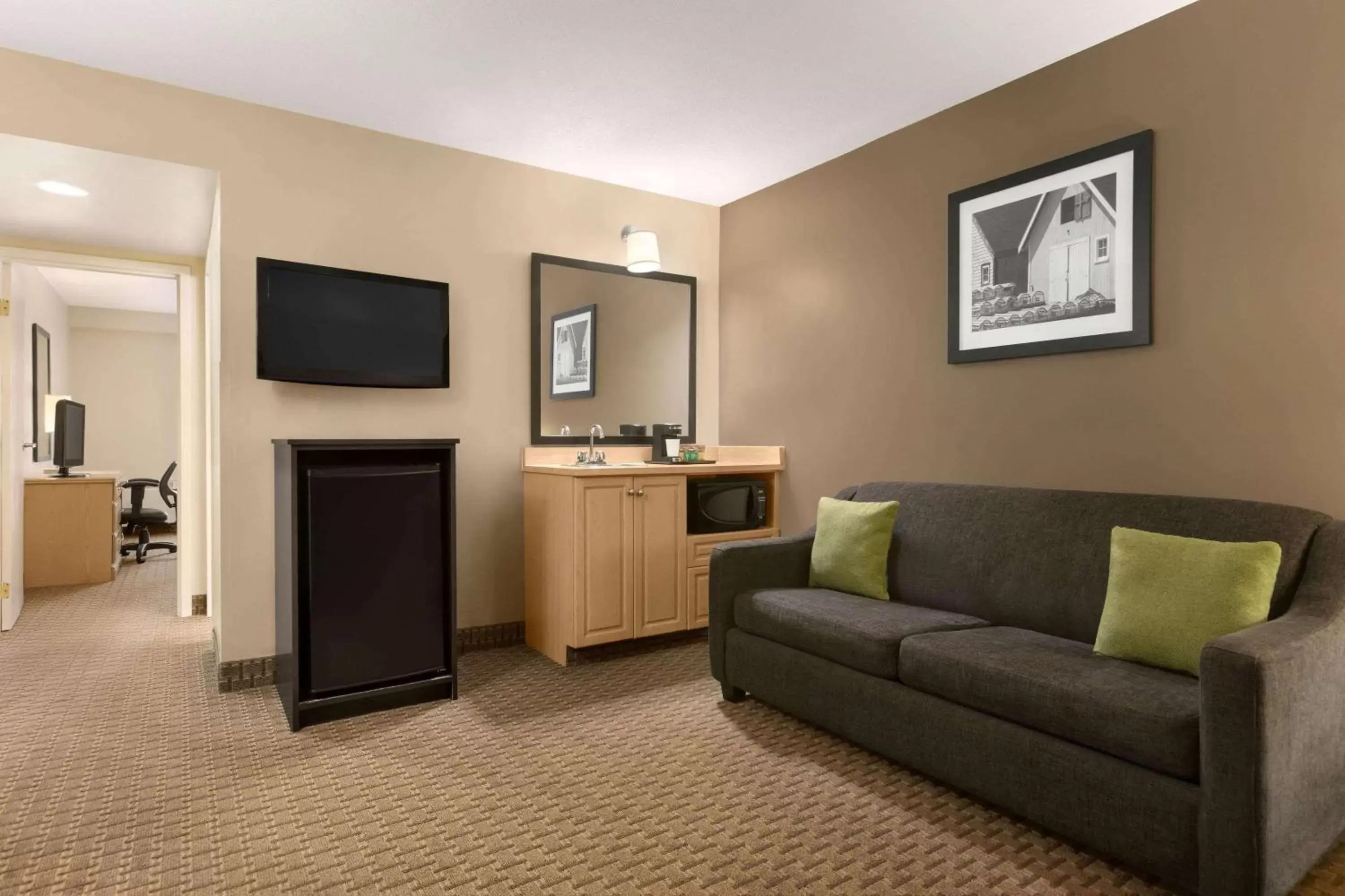 Photo of the whole room, Seating Area in Travelodge Suites by Wyndham Moncton