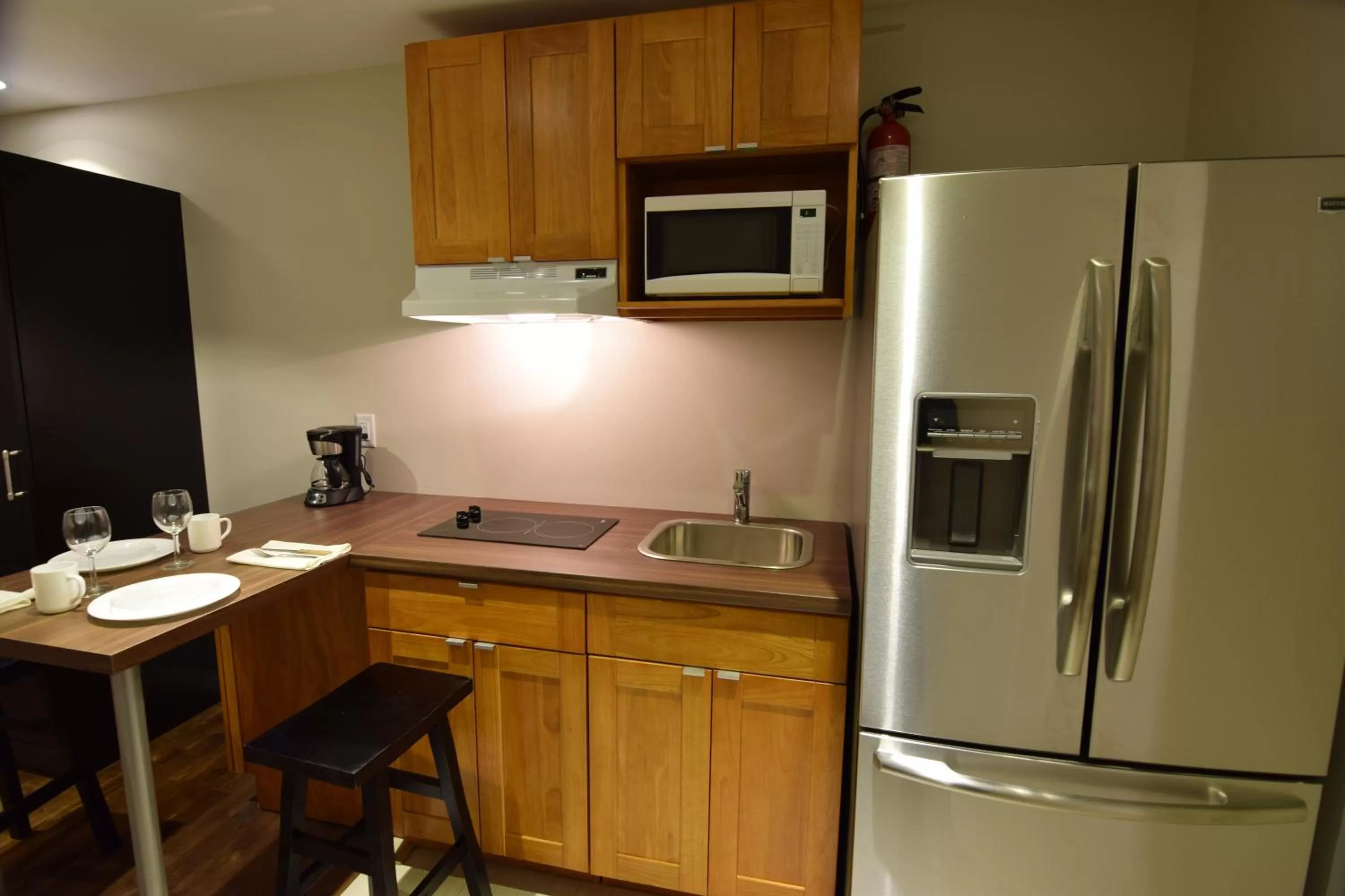 Kitchen or kitchenette in The Lion Inn & Suites