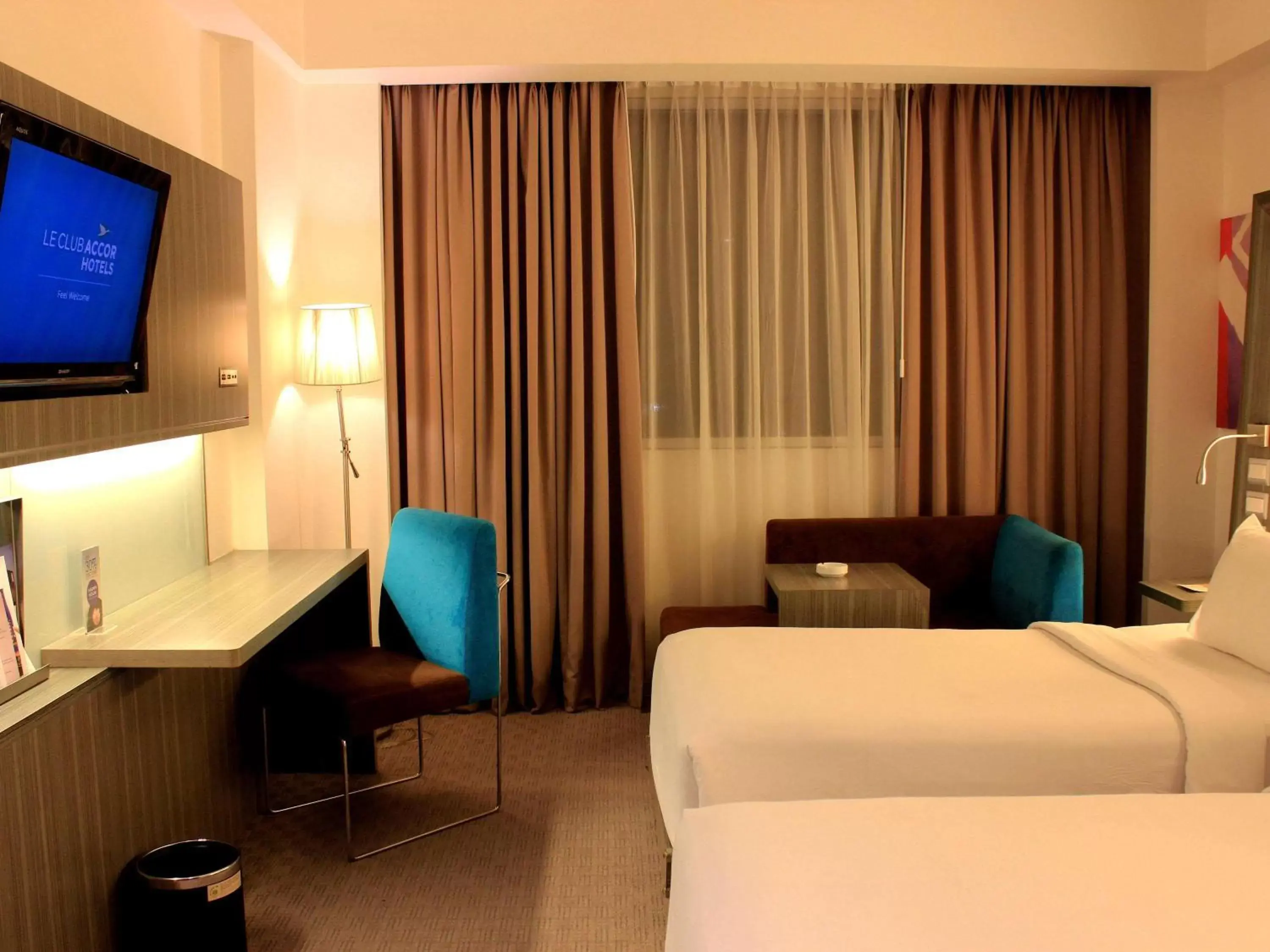 Photo of the whole room, TV/Entertainment Center in Novotel Bangka Hotel & Convention Center