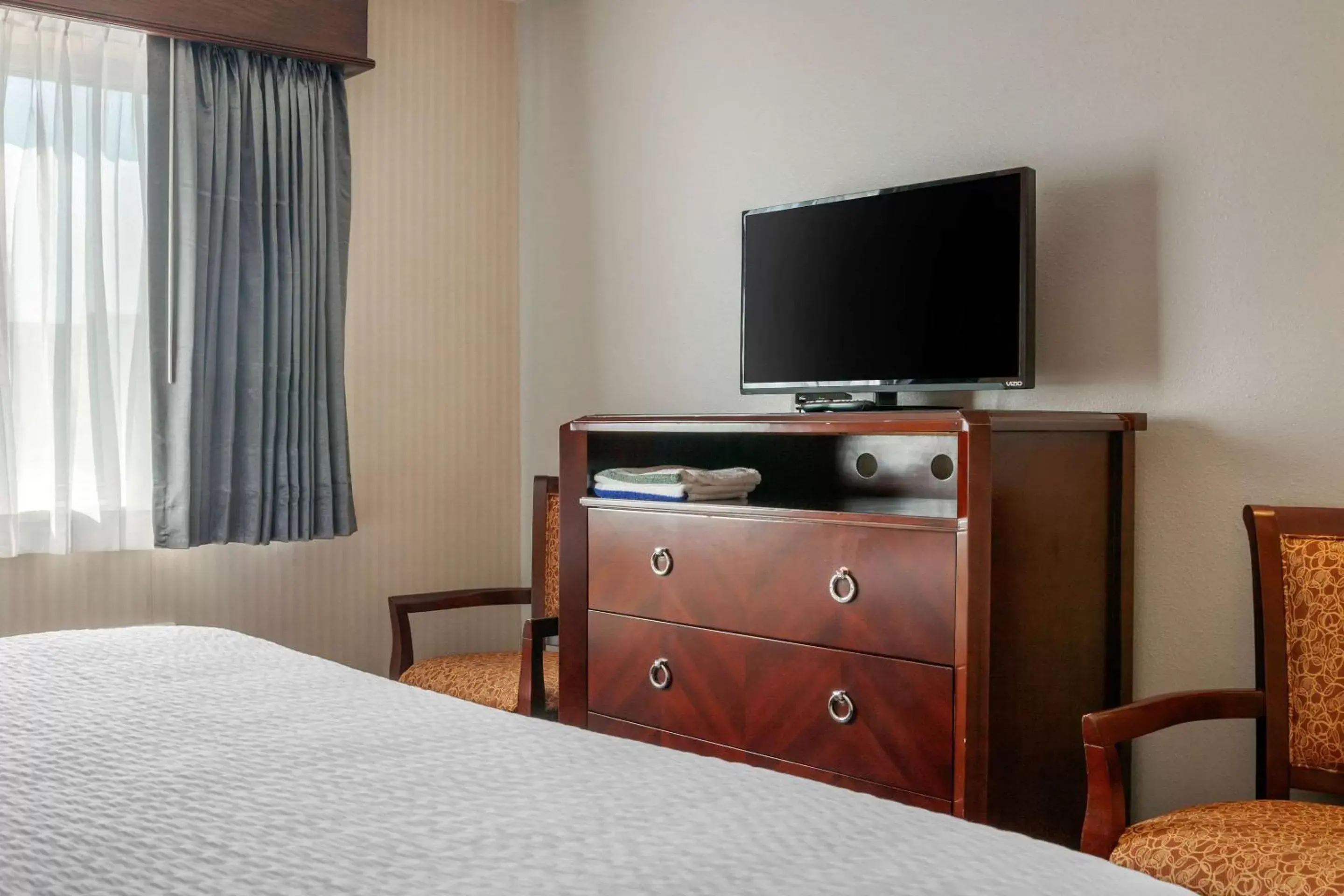 Photo of the whole room, TV/Entertainment Center in Clarion Hotel & Suites