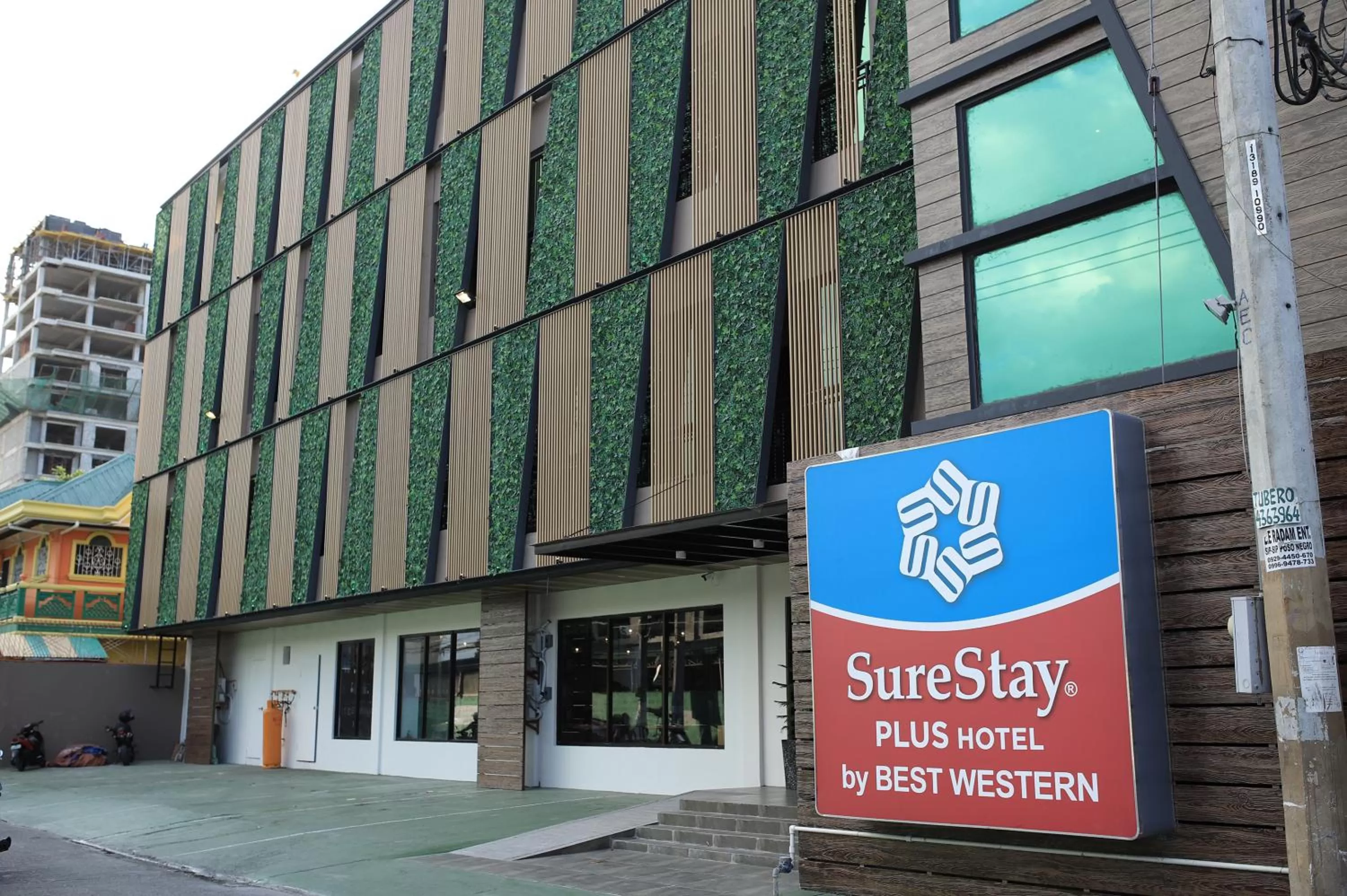 Property building in SureStay Plus Hotel by Best Western AC LUXE Angeles City