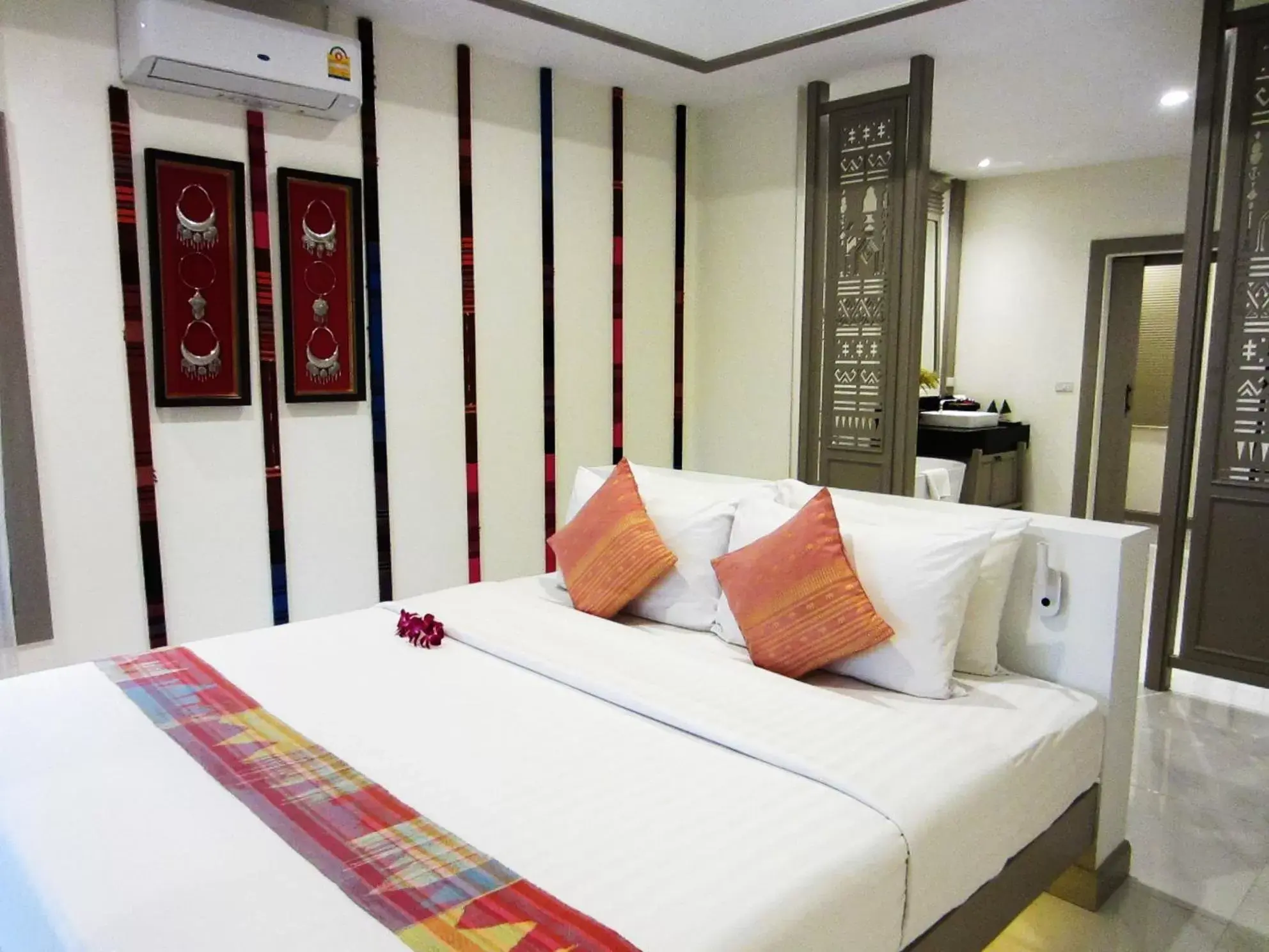 Bed in Lanna Dusita Riverside Boutique Resort