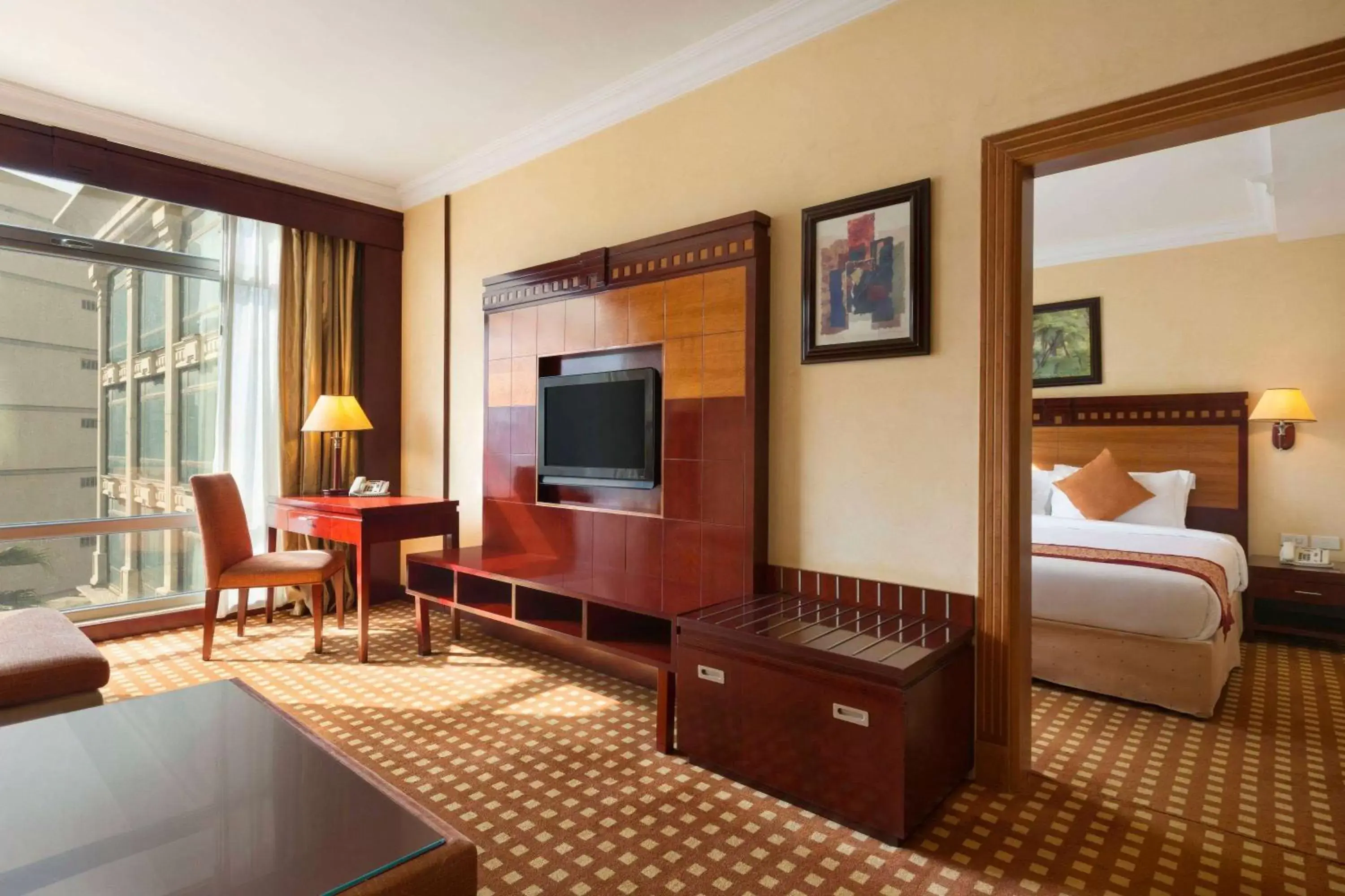 Bed, TV/Entertainment Center in Ramada by Wyndham Hotel Riyadh