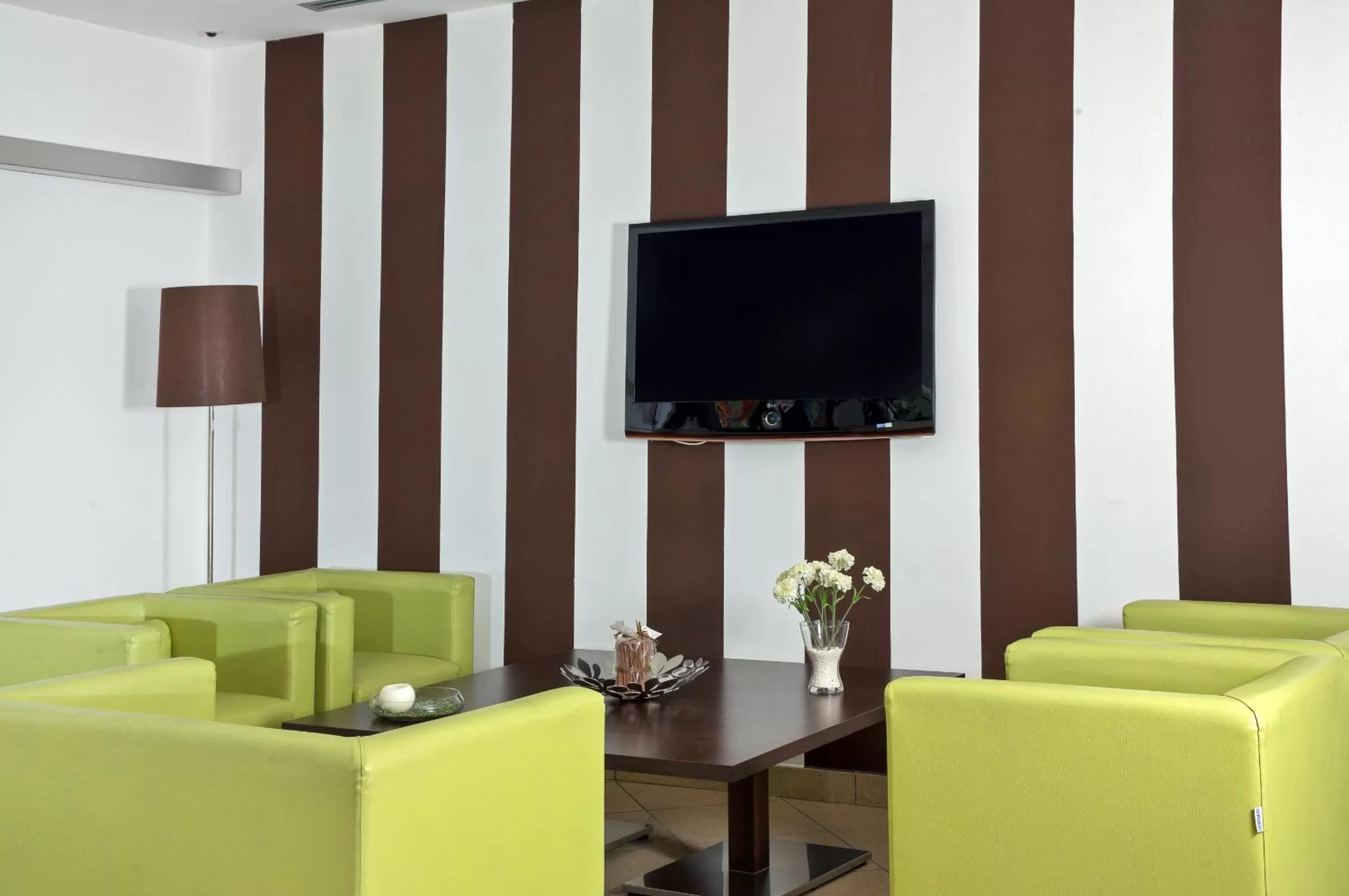 Communal lounge/ TV room in De Maria House