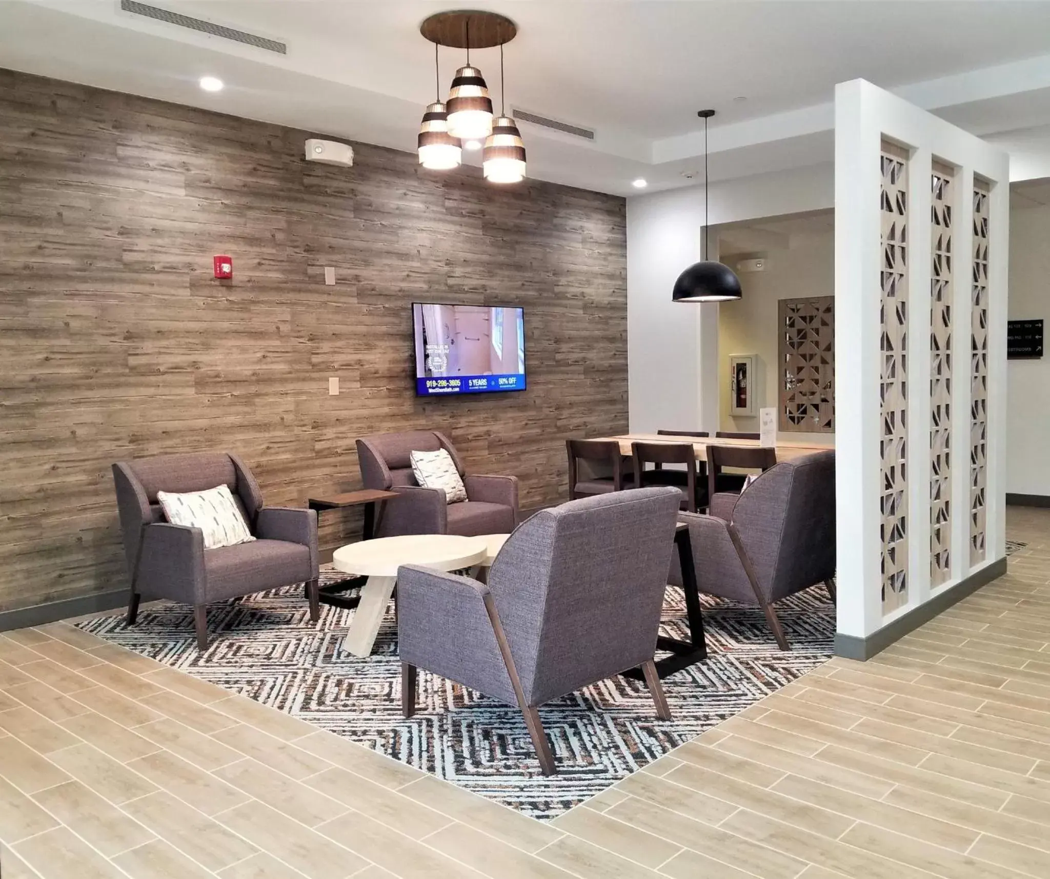 Lobby or reception, Seating Area in Candlewood Suites Apex Raleigh Area, an IHG Hotel