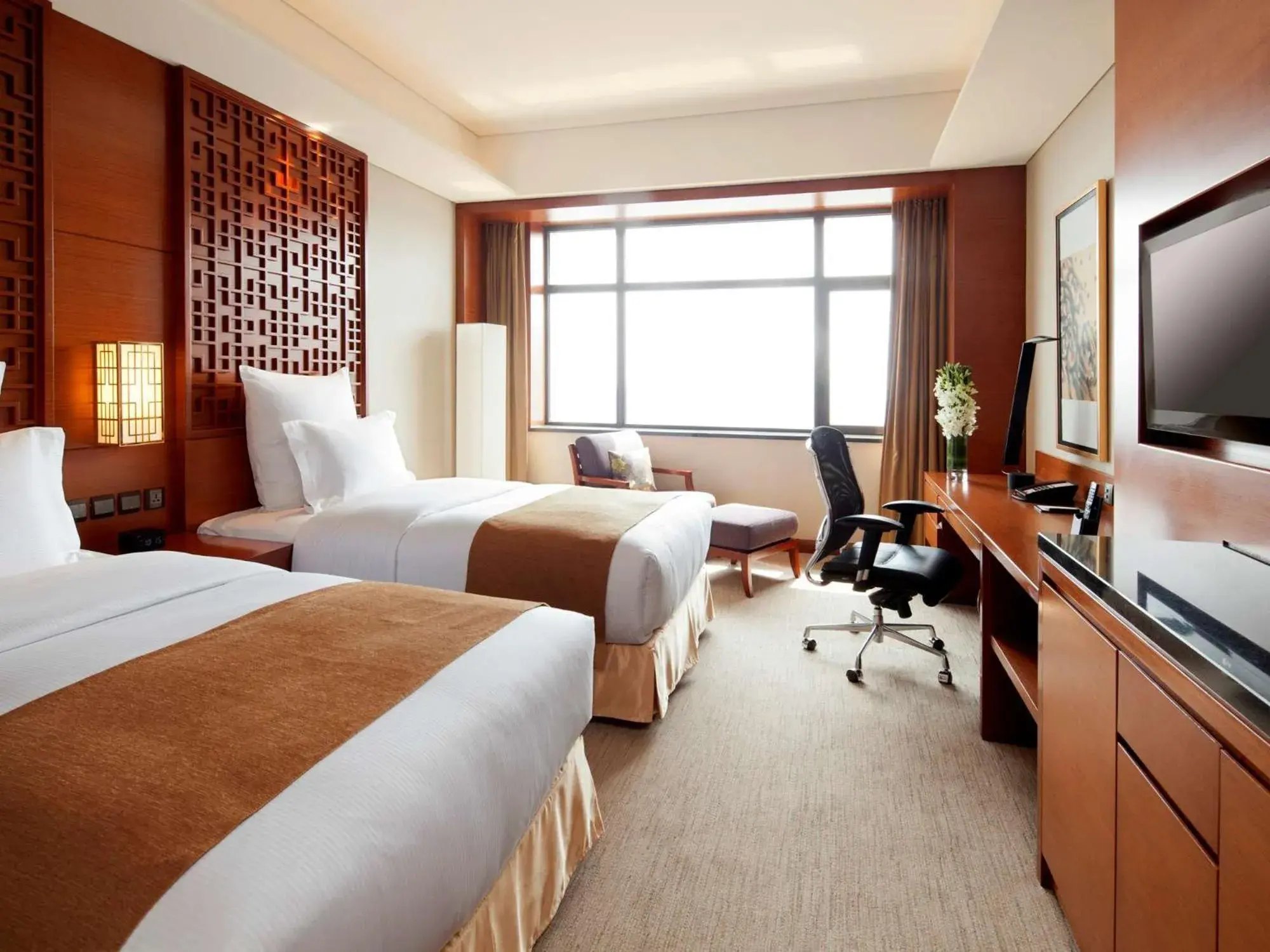 Bed in DoubleTree By Hilton Shenyang Hotel