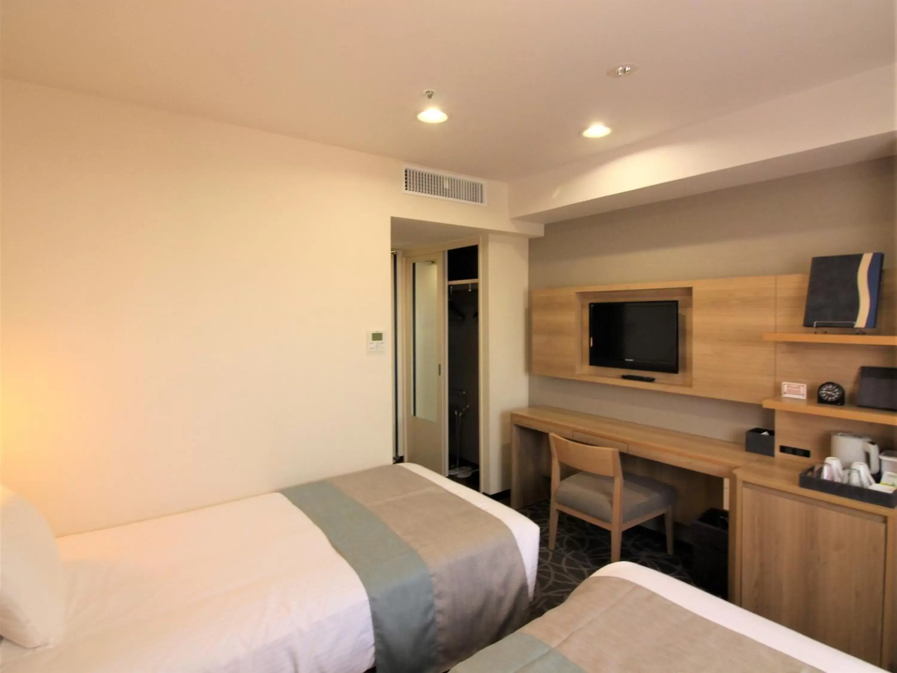 Photo of the whole room, Bed in Hotel Hokke Club Naha Shintoshin
