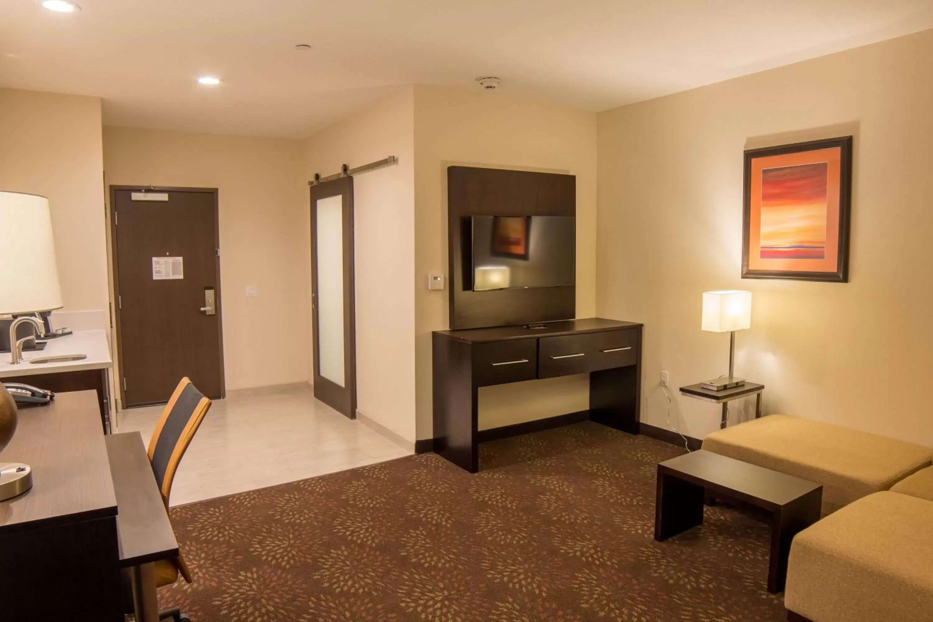 Photo of the whole room, TV/Entertainment Center in Holiday Inn Trophy Club, an IHG Hotel