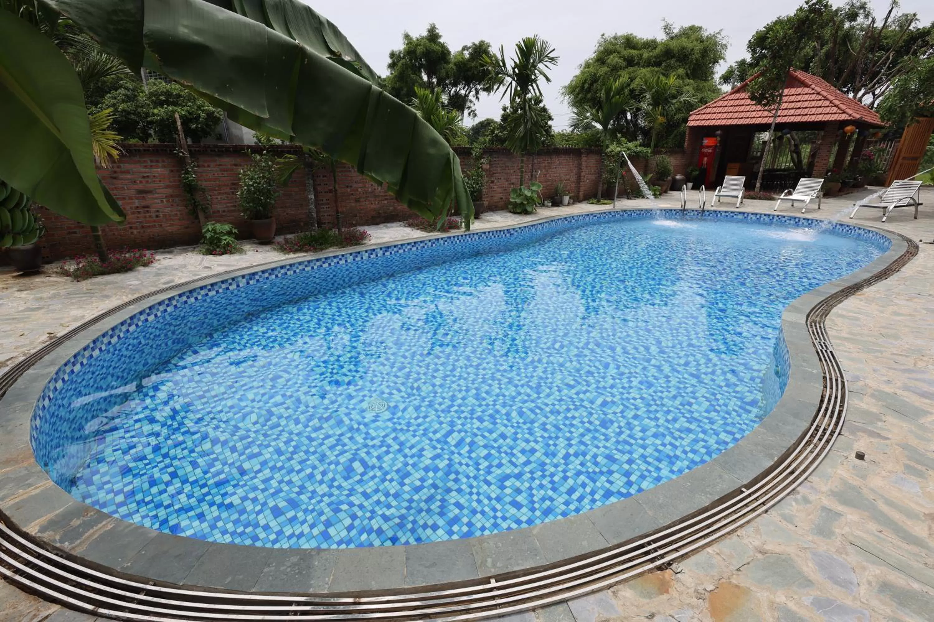 Swimming pool in Phạm Gia Homestay Ecogarden