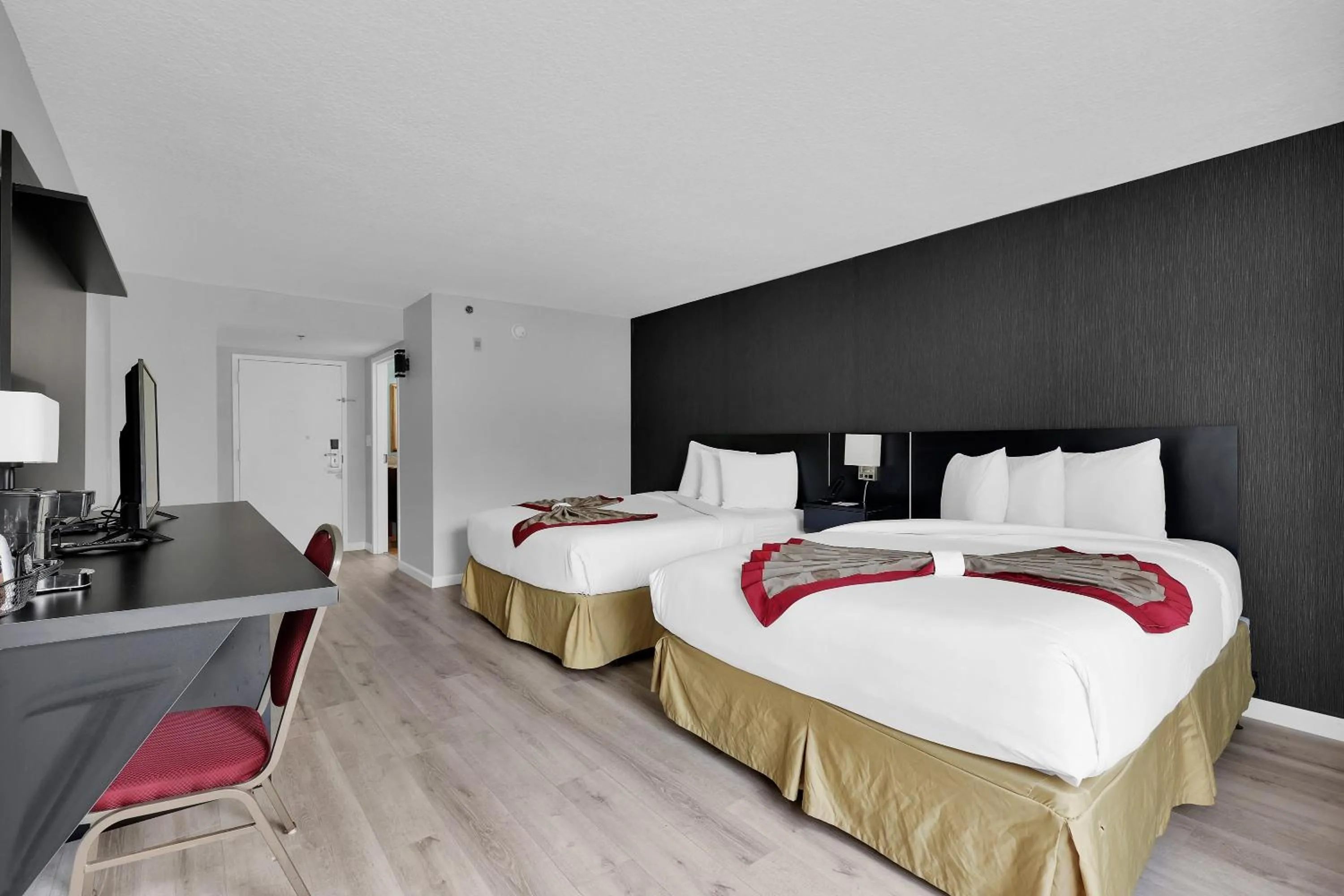 Bed in Ramada by Wyndham Jacksonville I-95 by Butler Blvd