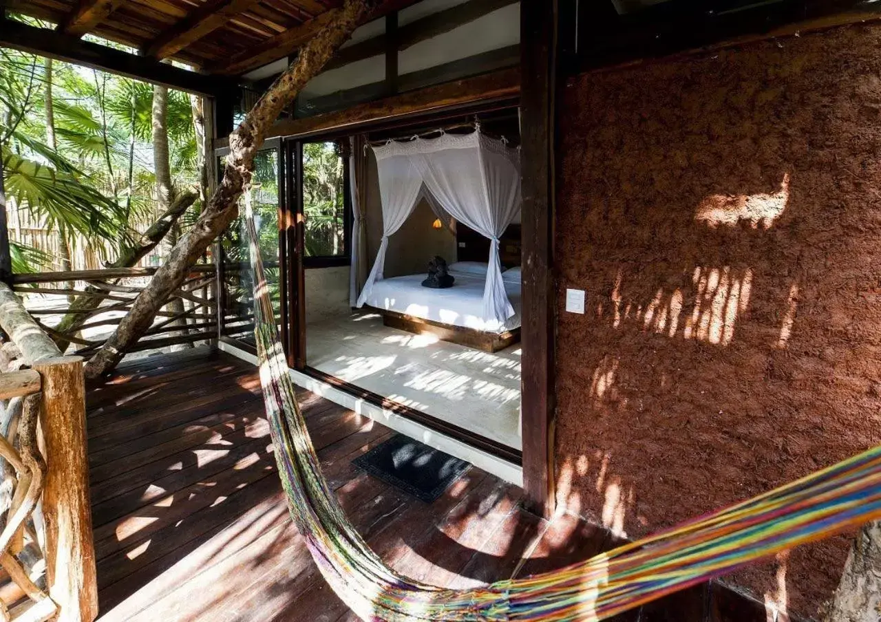 Bed in Hidden Treehouse Tulum Eco-Hotel