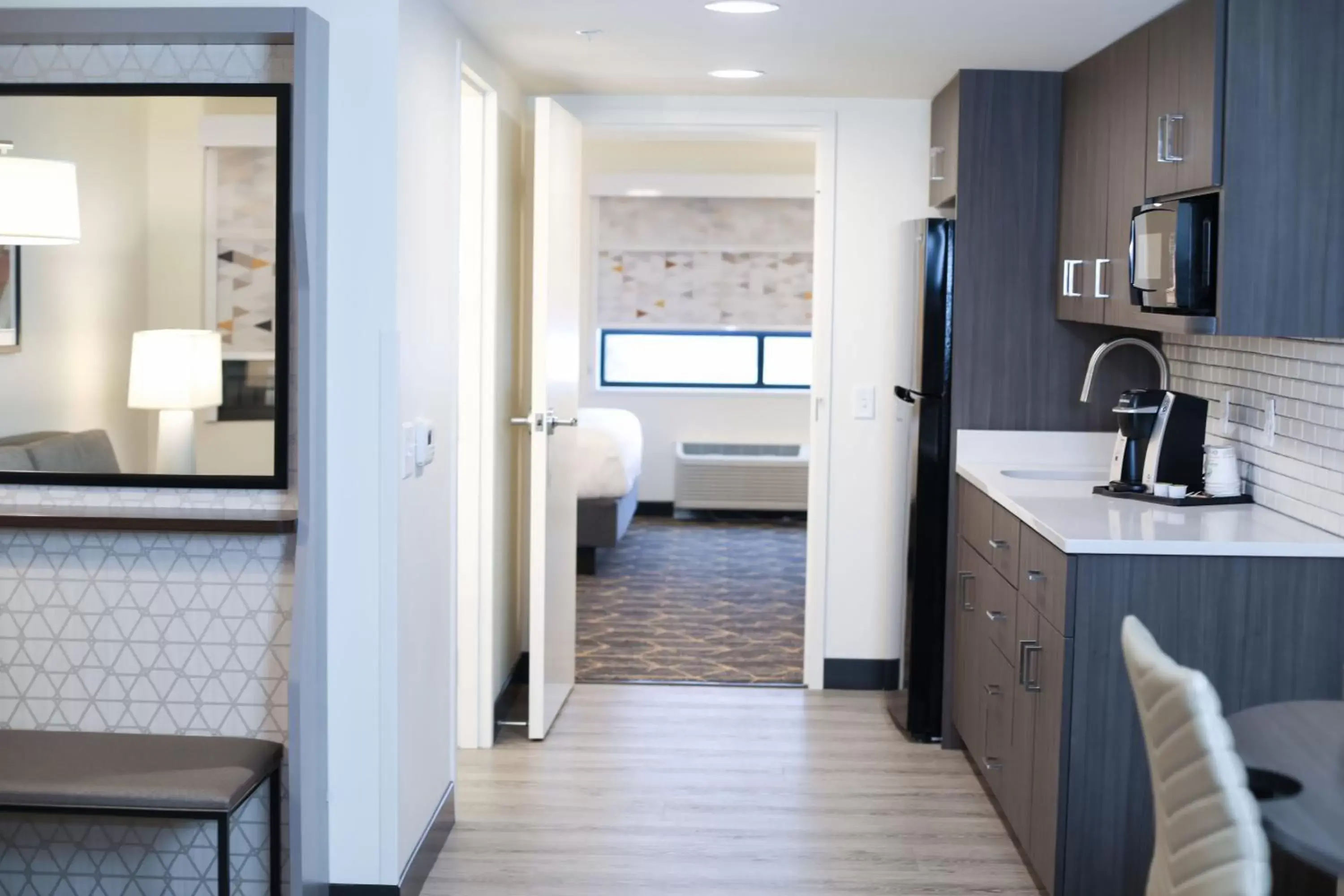 Photo of the whole room, Kitchen/Kitchenette in Holiday Inn & Suites St. Cloud, an IHG Hotel