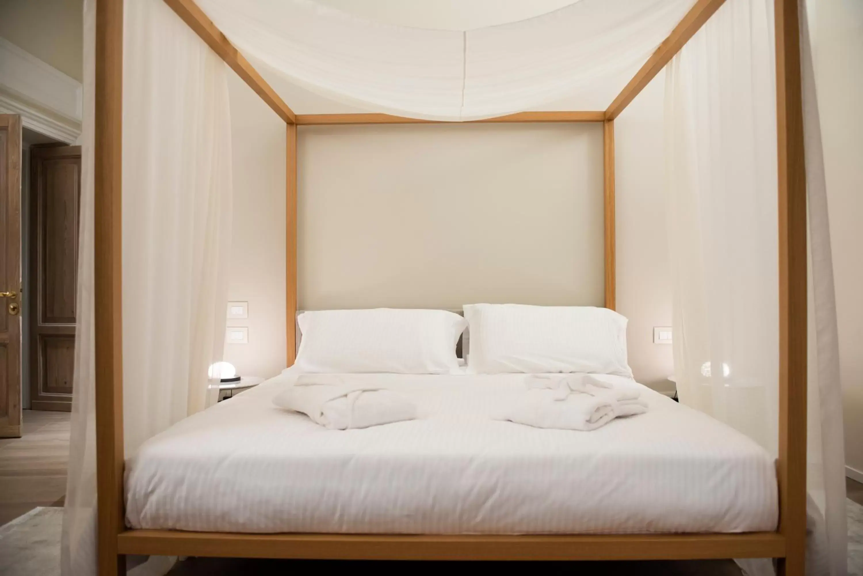 Bed in Dimora de Matera Luxury Suites