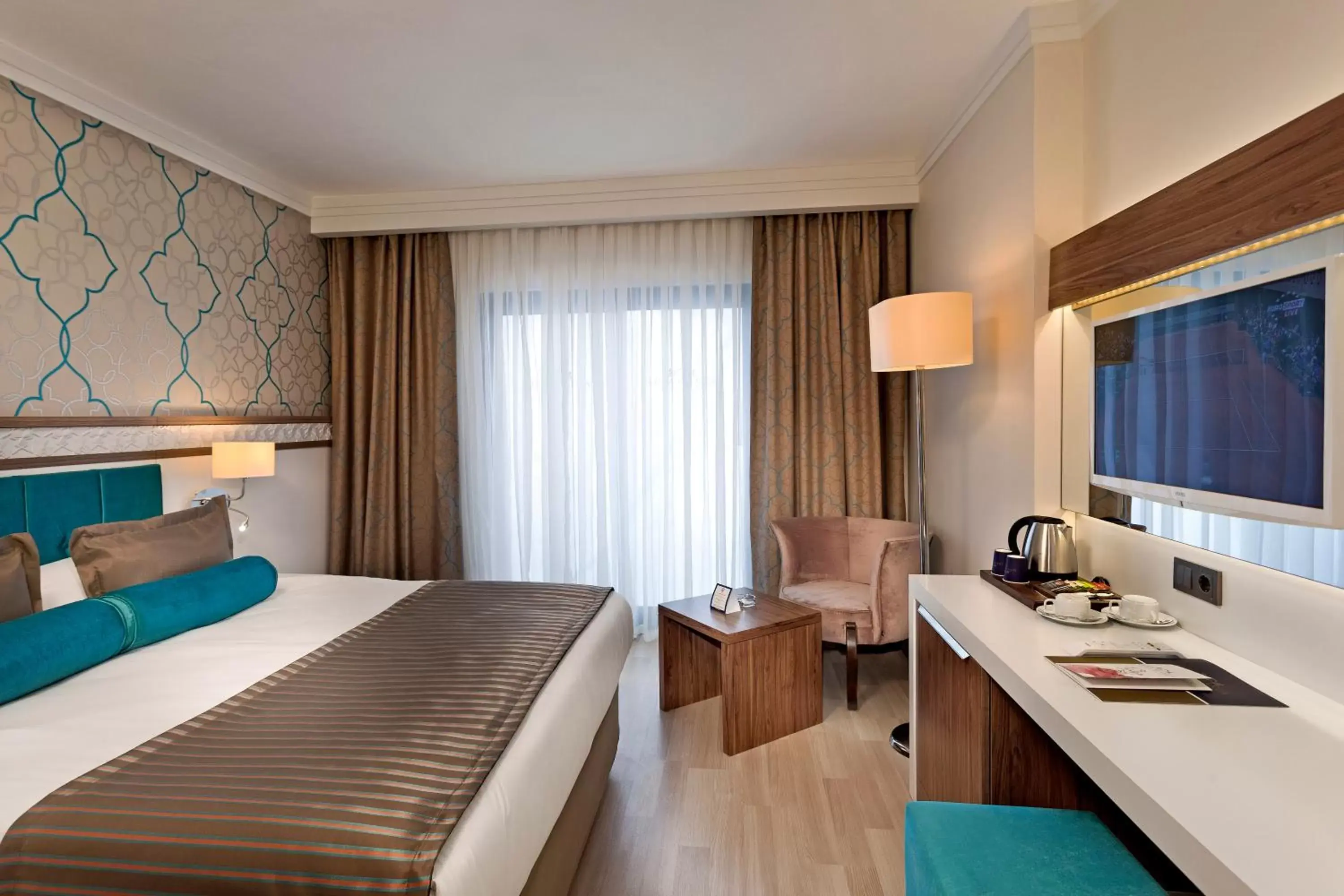 Bed, TV/Entertainment Center in Luna Blanca Resort & Spa - Ultra All Inclusive