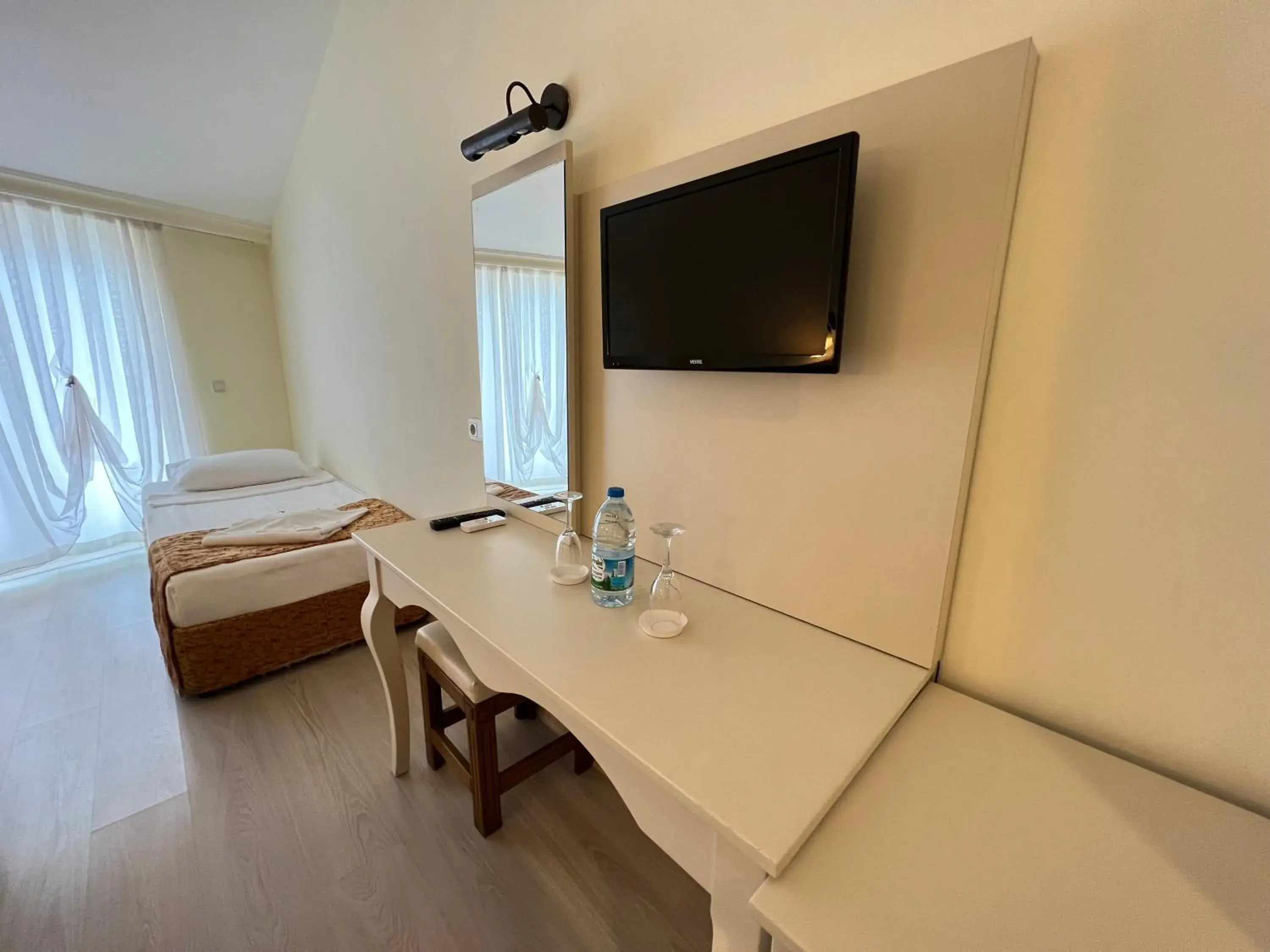 Bed, TV/Entertainment Center in Valeri Beach Hotel