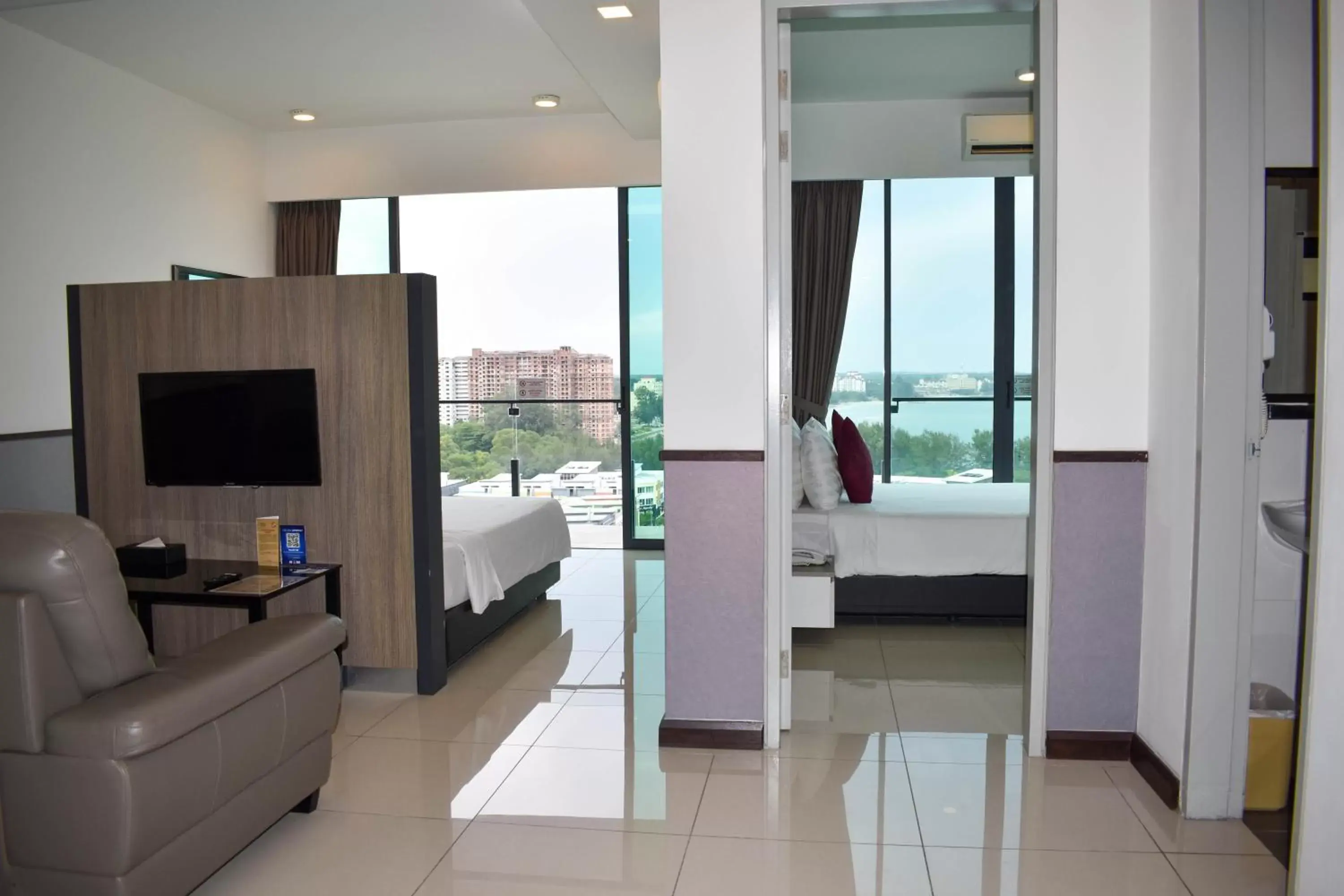 Bed, TV/Entertainment Center in D'Wharf Hotel & Serviced Residence