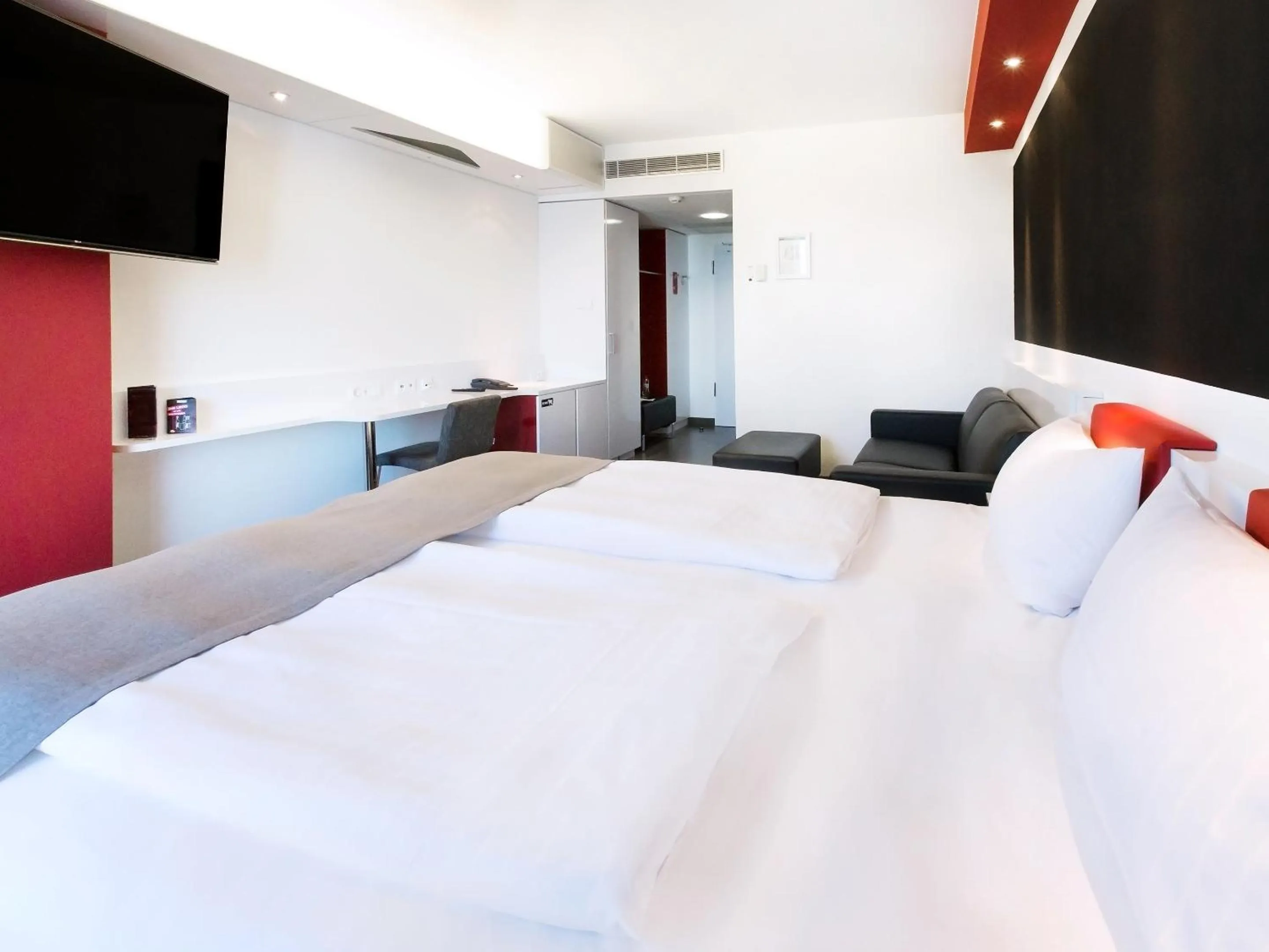 Photo of the whole room, Bed in DORMERO Hotel Stuttgart