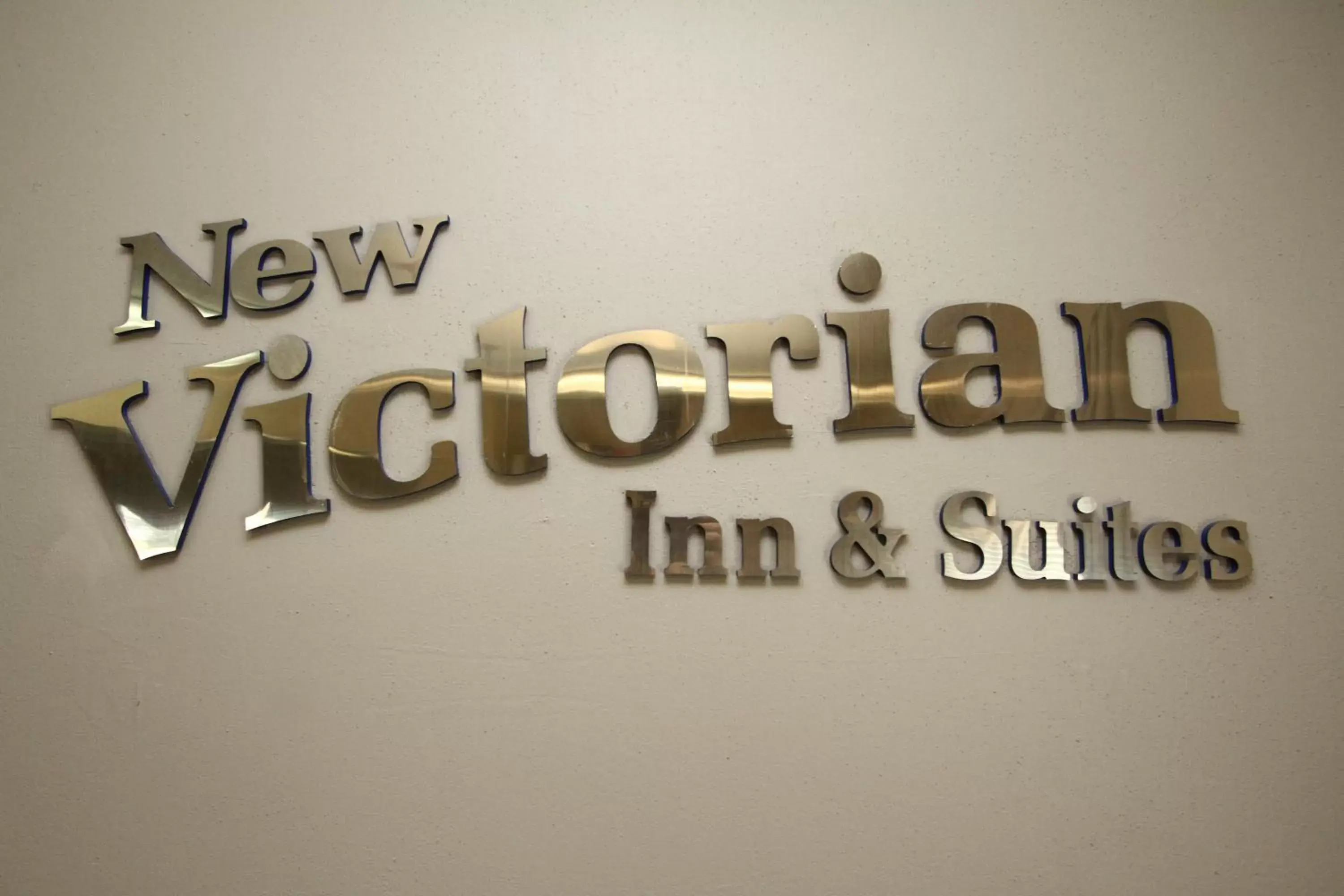 Property logo or sign in New Victorian Inn & Suites Kearney