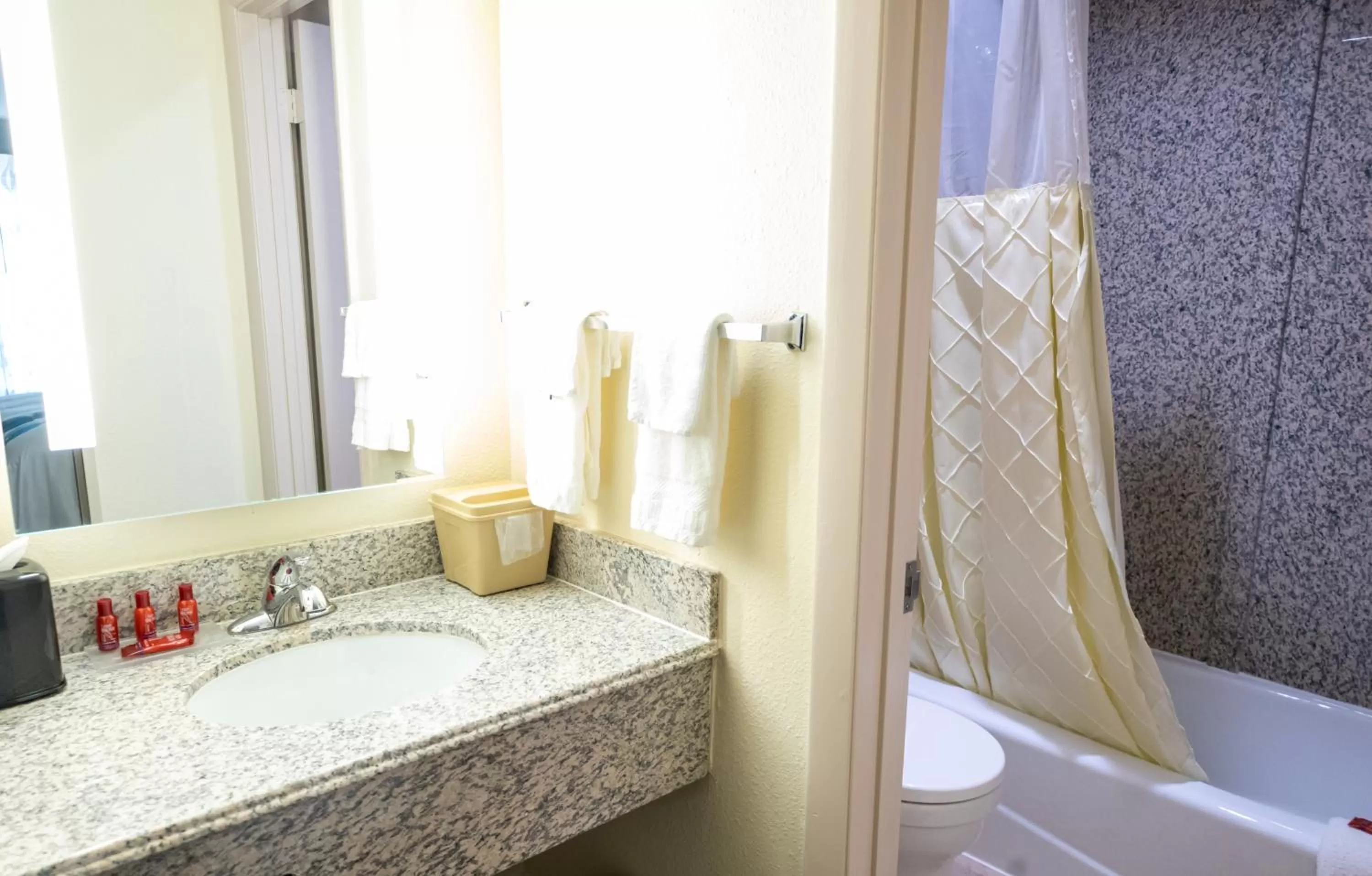 Bathroom in Days Inn by Wyndham College Park Atlanta Airport South