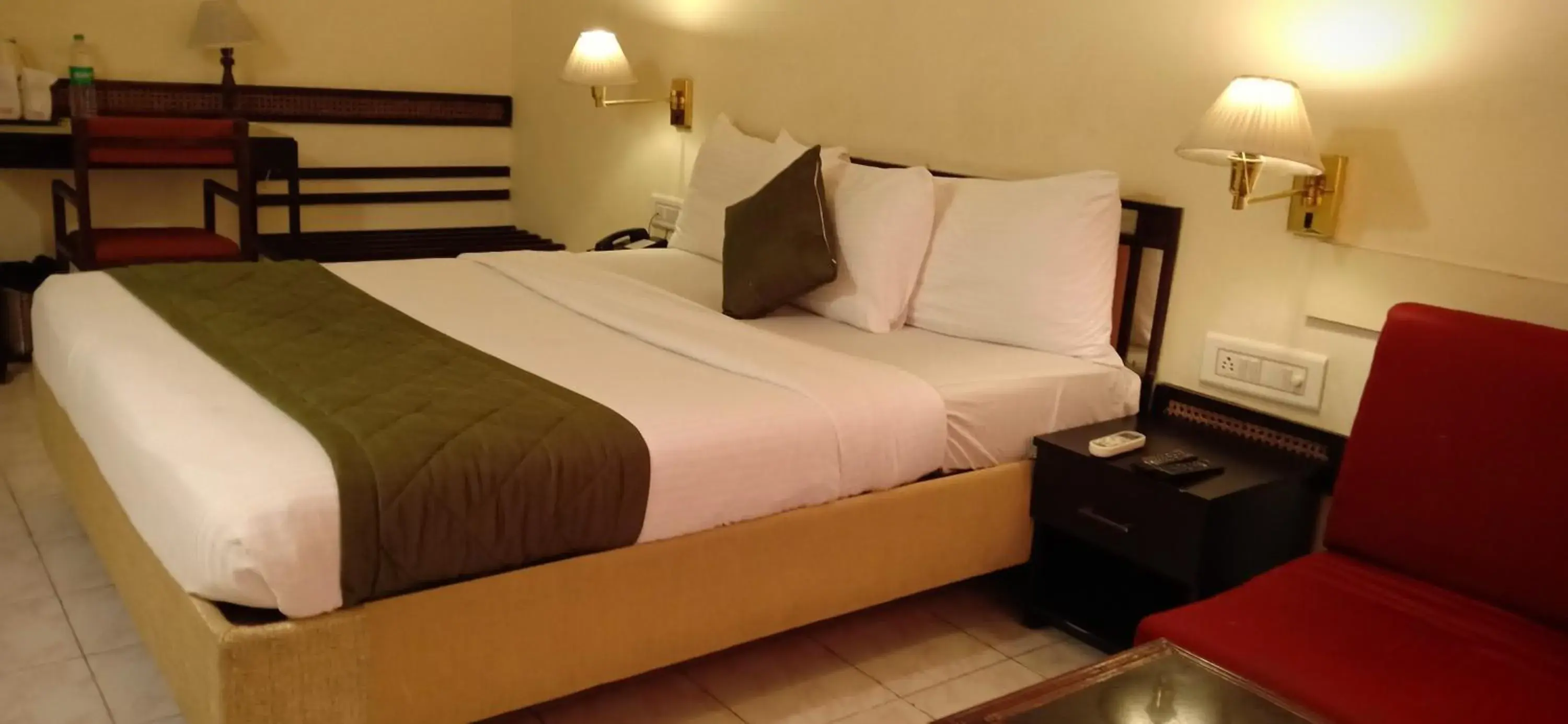 Bed in Hotel Poonja International