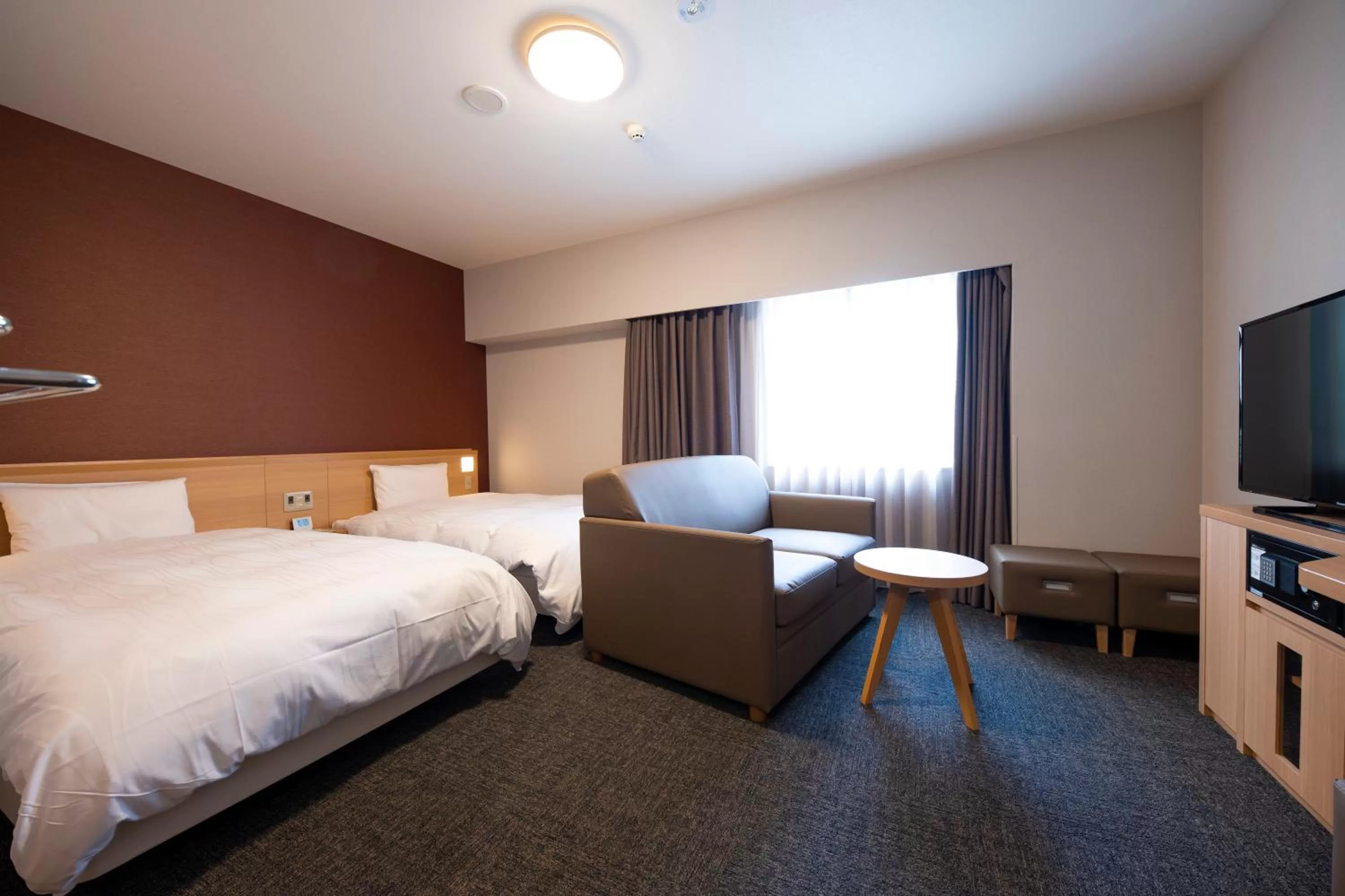 Bed in Dormy Inn Premium Nagasaki Ekimae