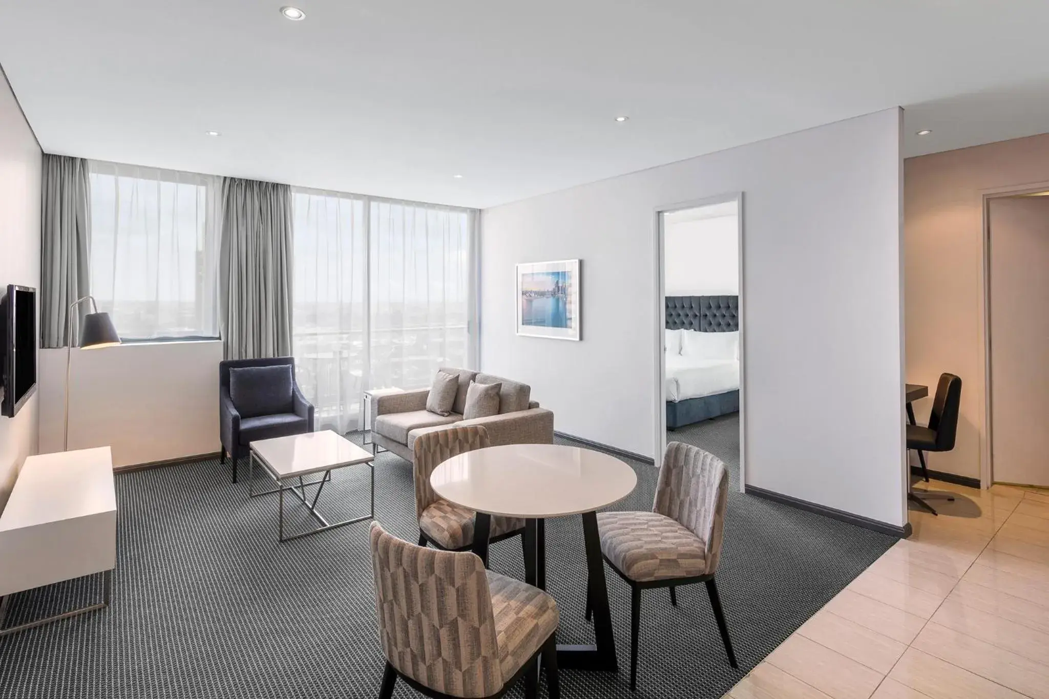 Bed, Seating Area in Meriton Suites Campbell Street, Sydney