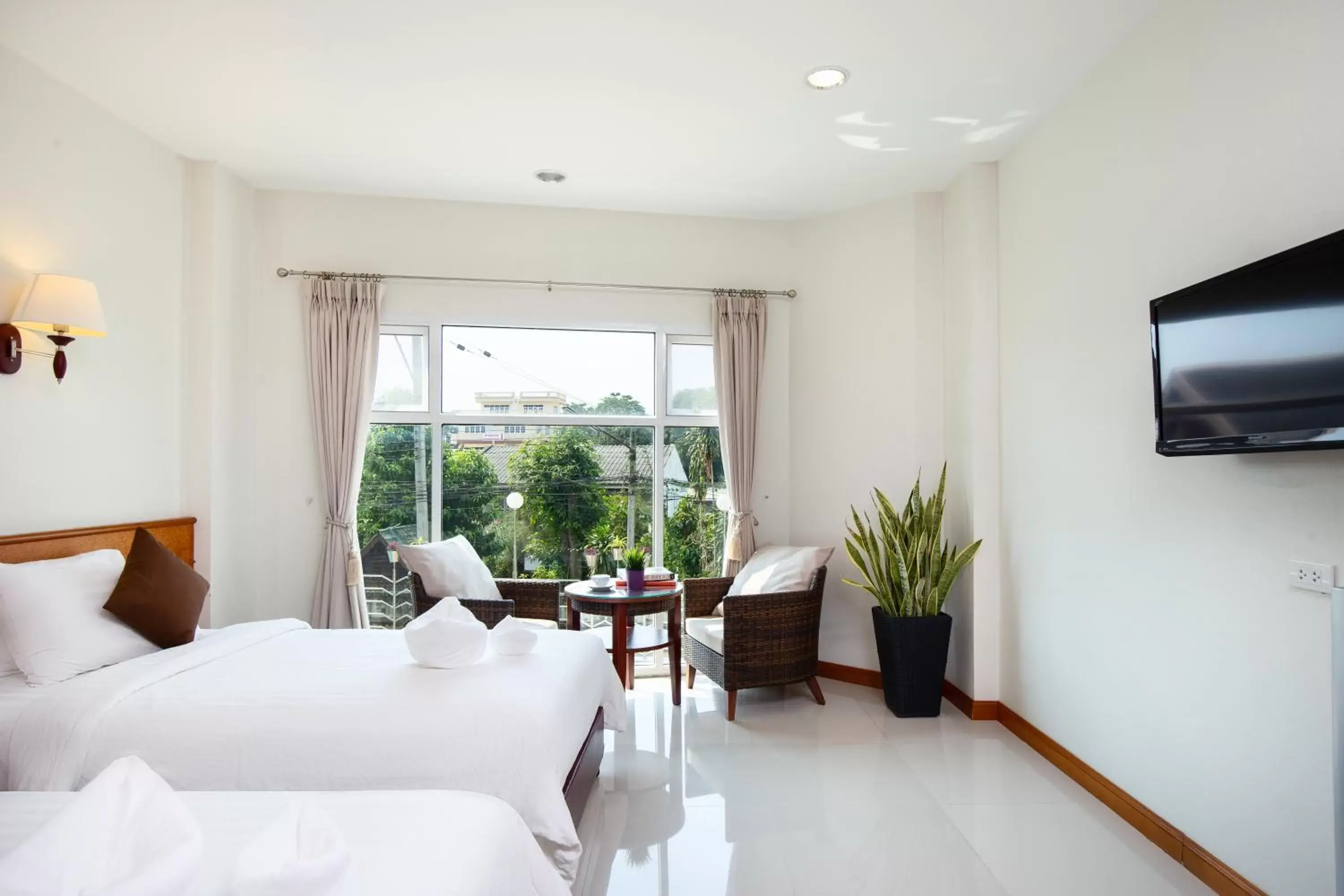 Bed in Kanchanaburi City Hotel - SHA Extra Plus